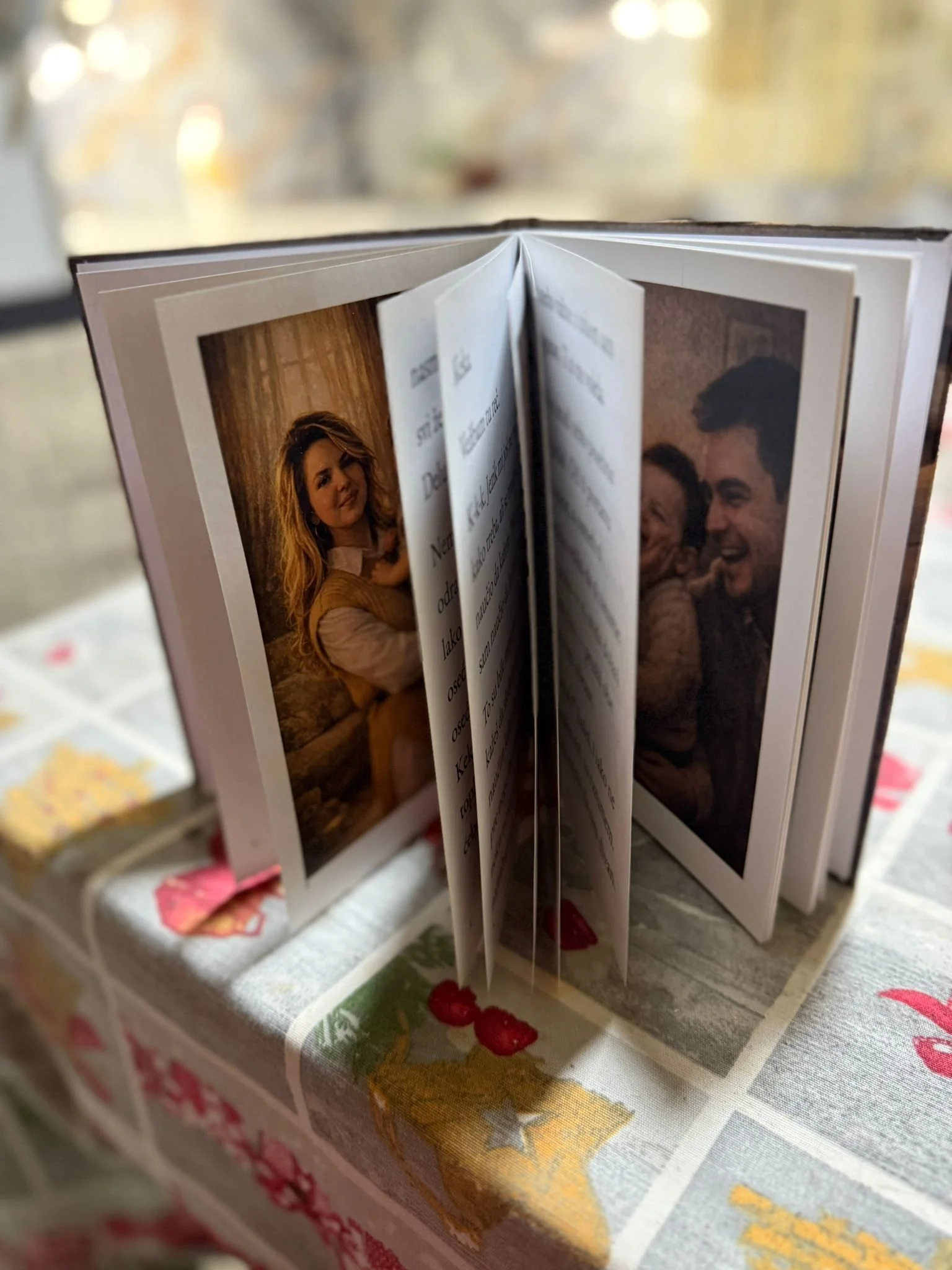Open photo album with pictures inside, showing a woman on the left and a smiling man and woman on the right.