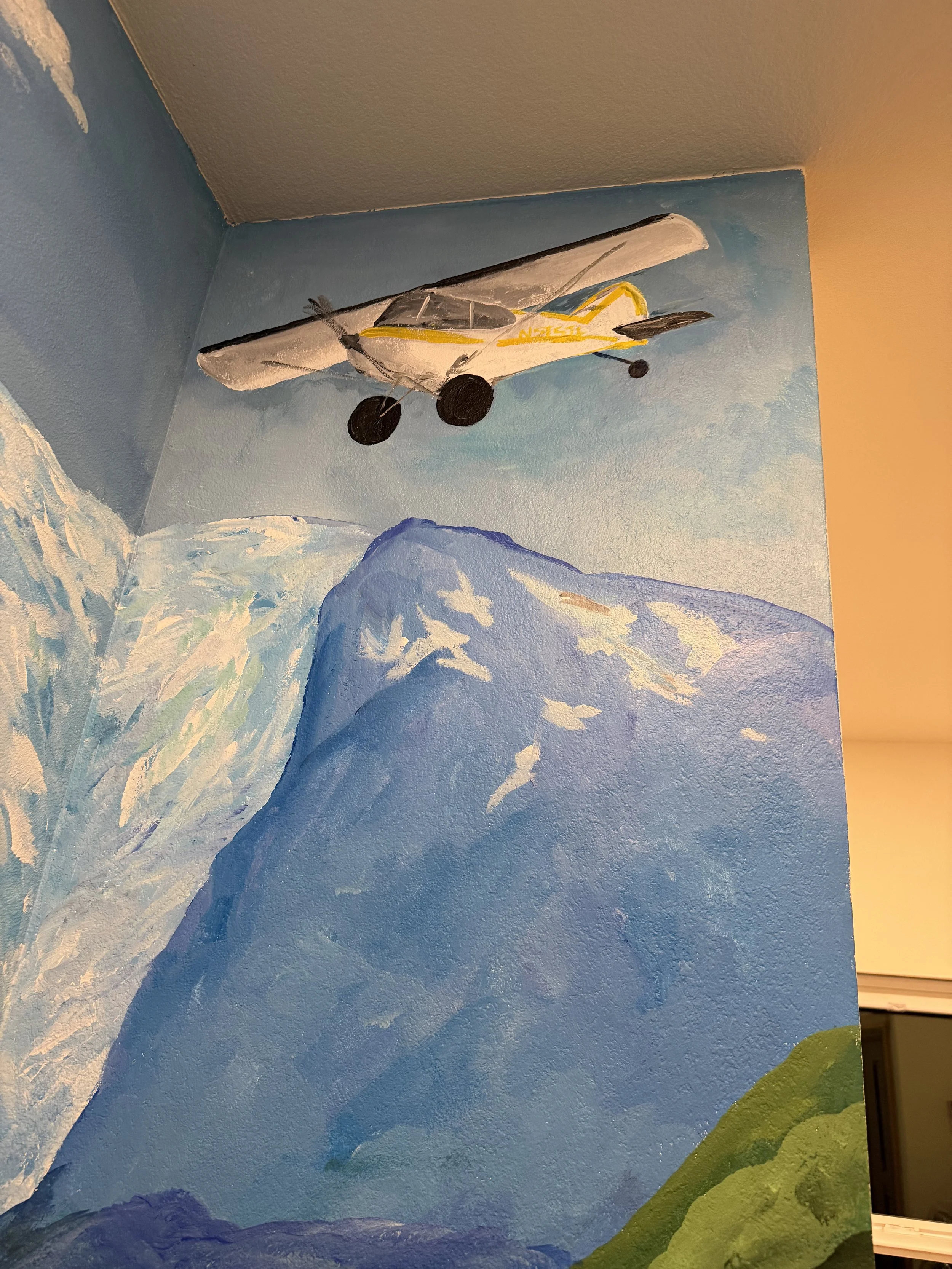 Whimsical mural created for a beautiful Airbnb in Girdwood, blending my landscape style with the client's favorite things about Girdwood.  