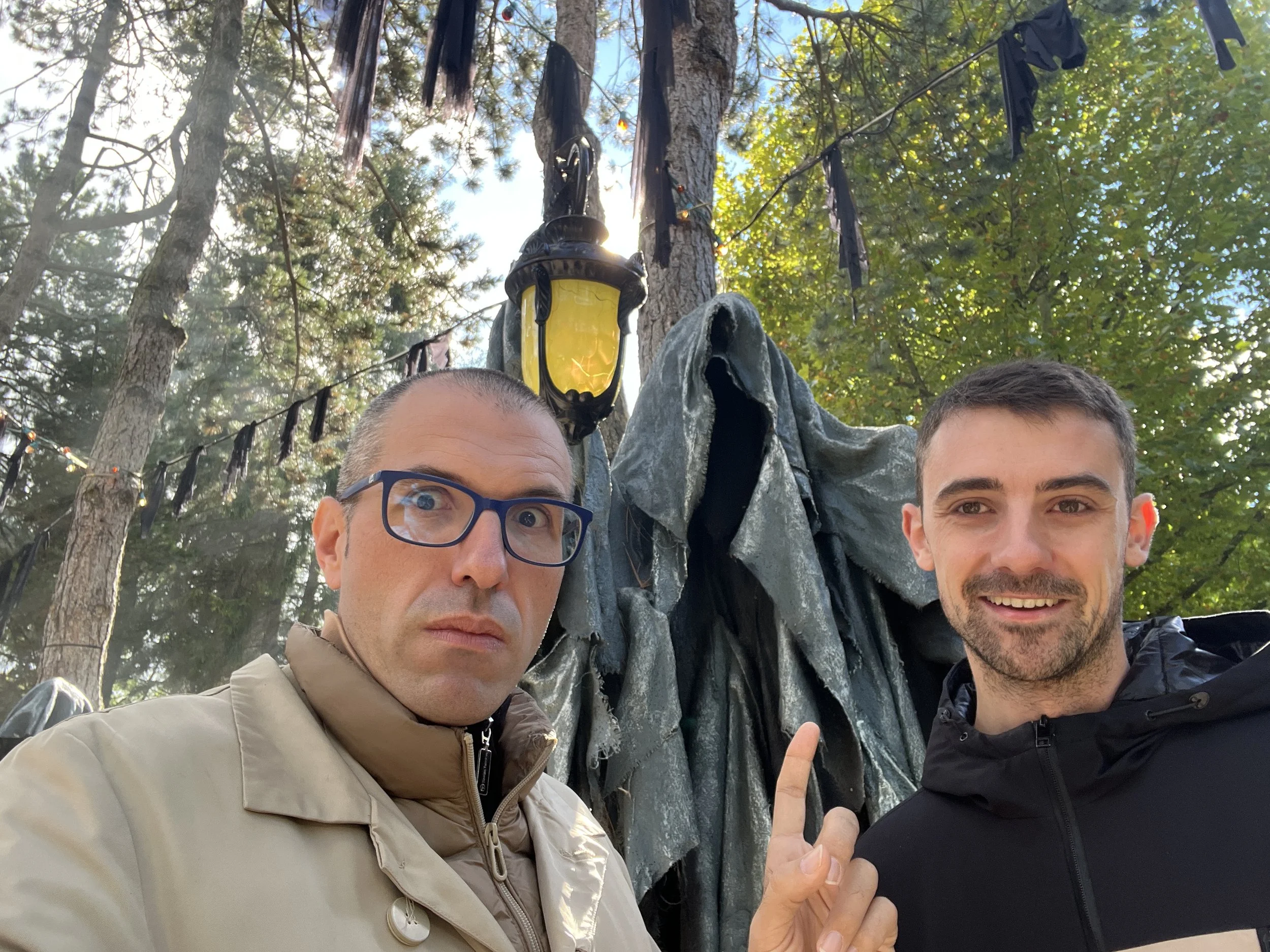 Selfie of Gerard Pastor and Roger Piqué with a ghostly sculpture behind them. Photo taken at Nigloland.