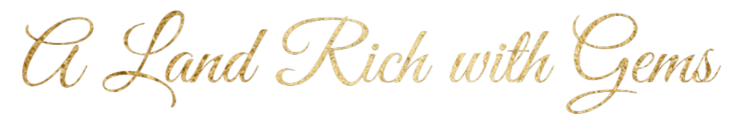 Golden cursive text stating "A Land Rich with Gems" on a black background.