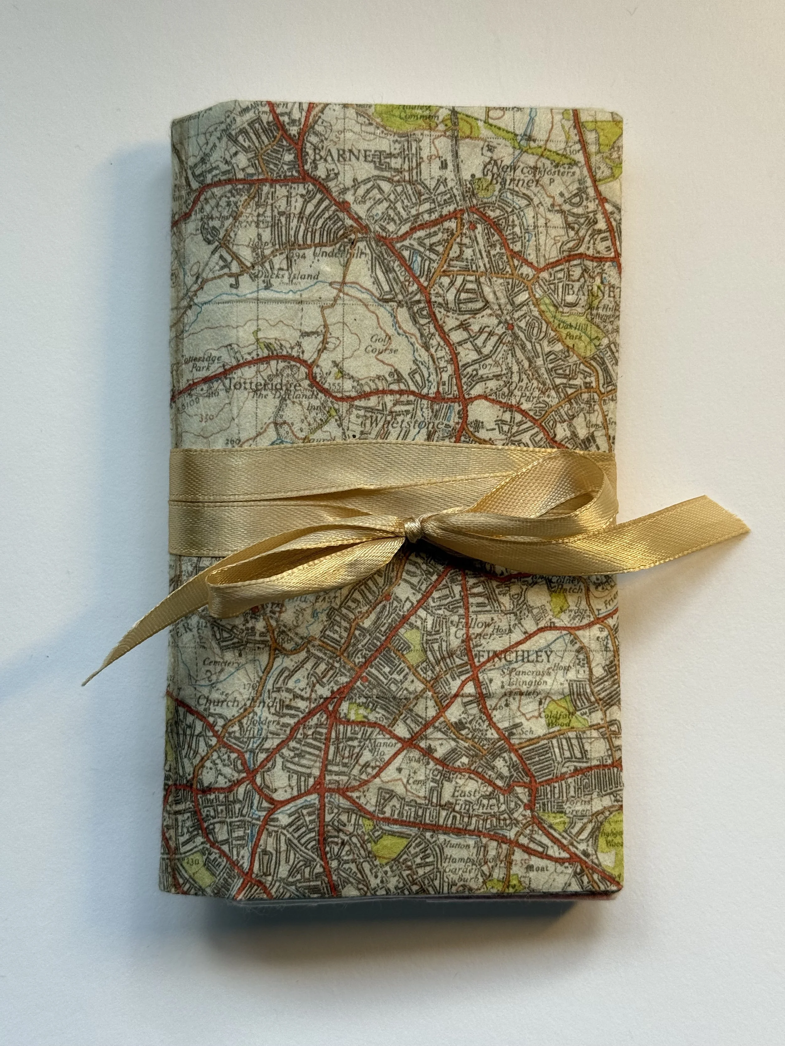 Closed thread book with a map of Barnet, London cover