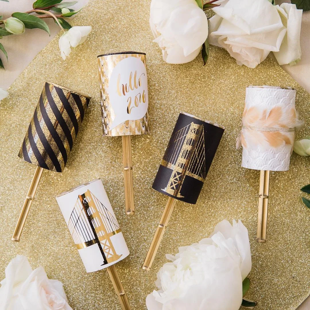 Featured today on @stylemepretty one of our favorite weddings from 2016 #NYE #sfwedding ! Custom poppers made from custom foil designs, glitter, hand painted feathers and #bling papers. Each popper was unique and featured personalized details of the 