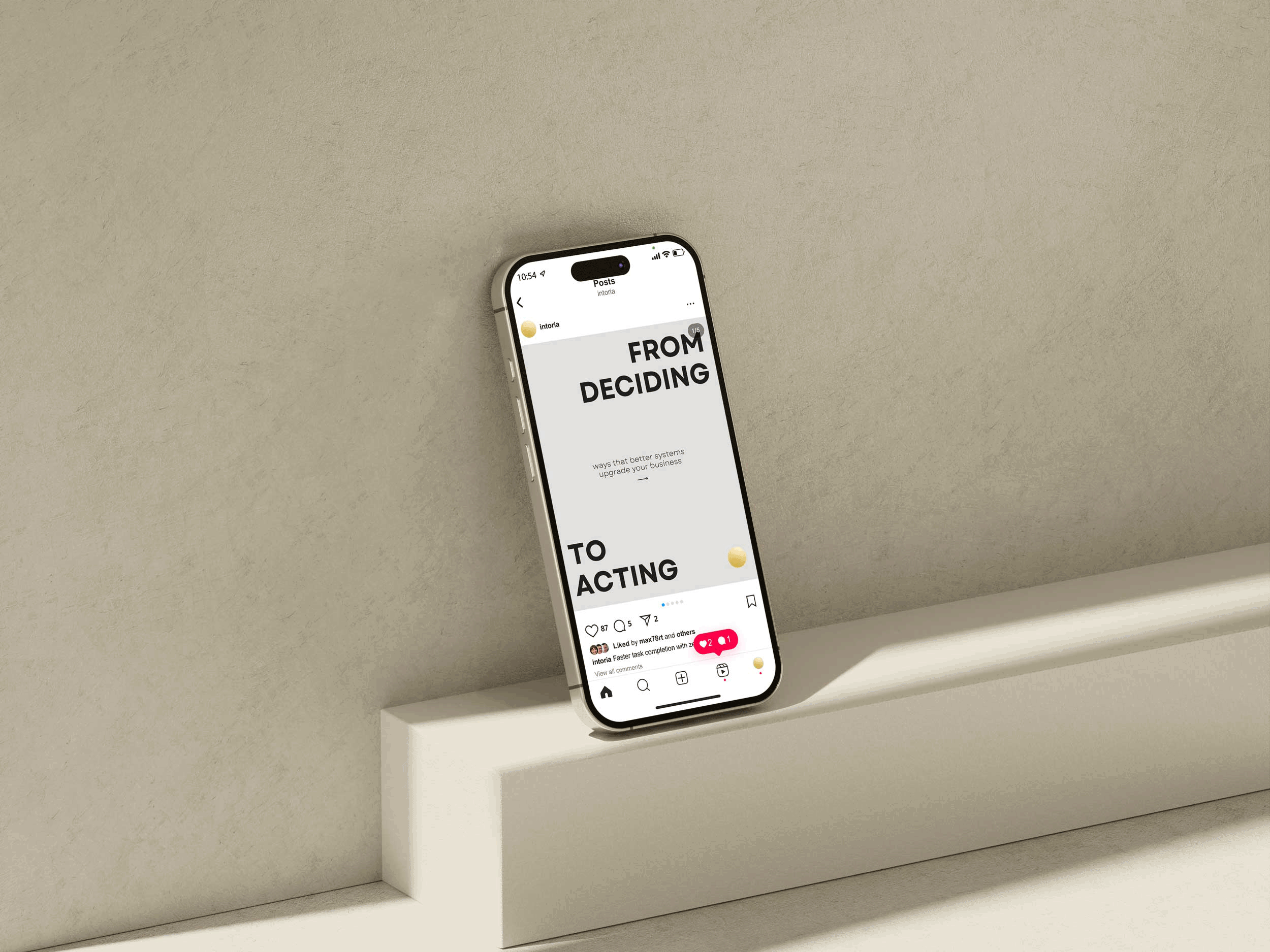 Smartphone on a white display stand showing a social media post with the prominent text "FROM DECIDING TO ACTING".