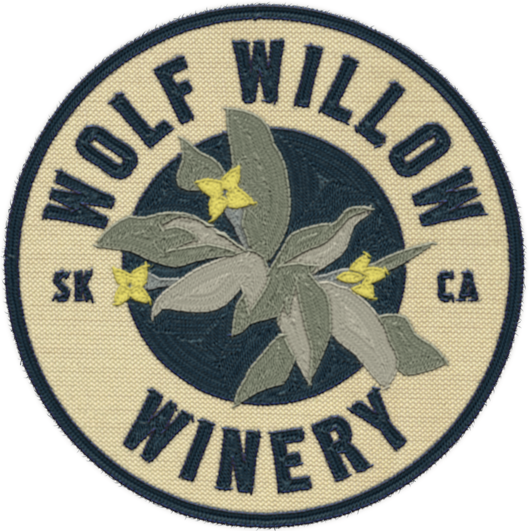Patch with a circular design that reads 'Wolf Wild Wollow Winery' around the edge, with a central illustration of a flowering branch with yellow flowers and silvery leaves.