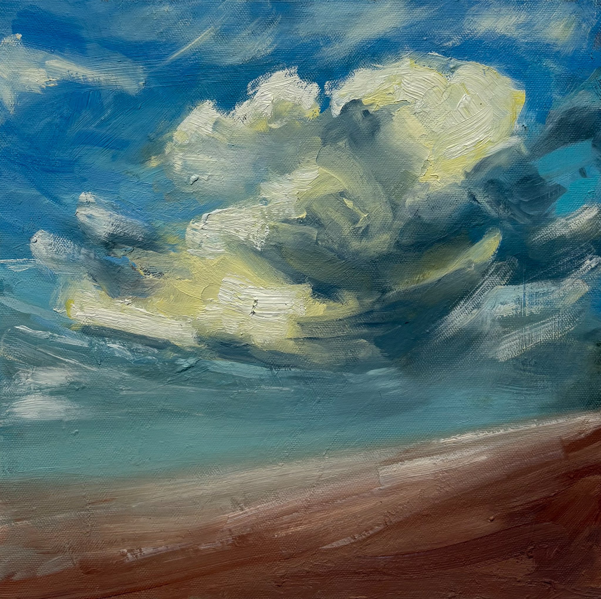 Monica Guillory: Sky with large, white, yellow, and gray clouds over a reddish sandy beach.