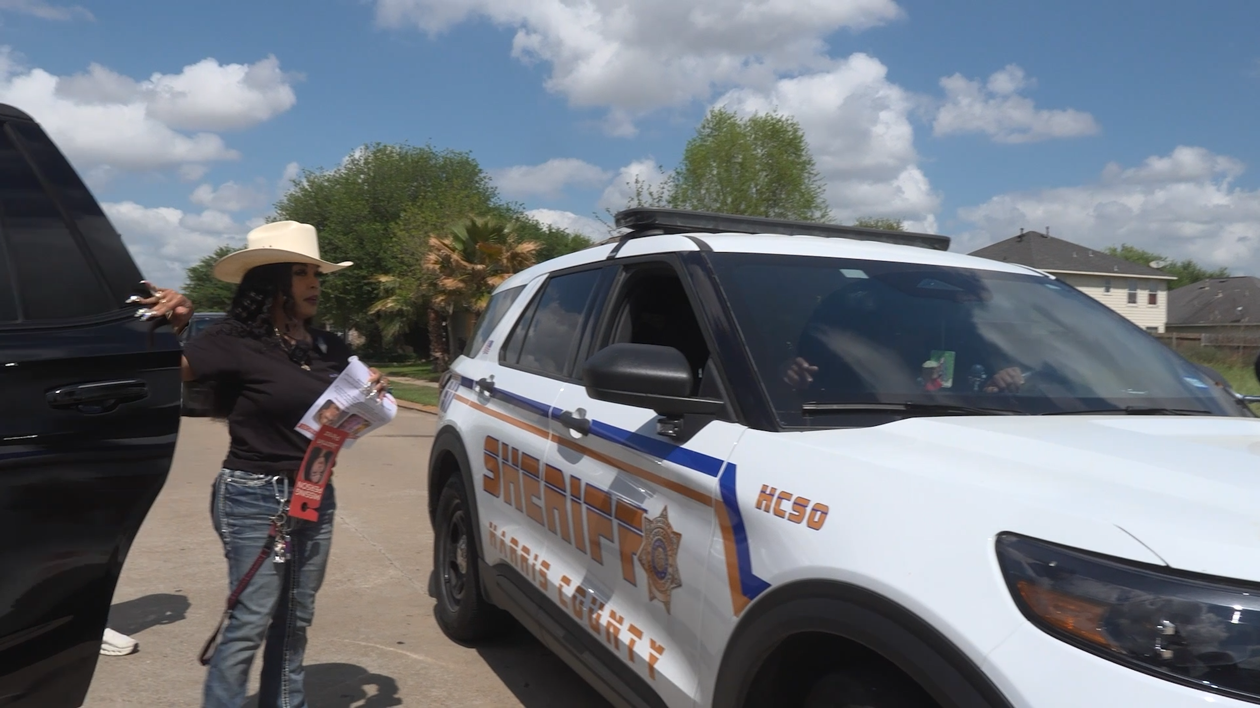 Dr. Candice Matthews Distributes Flyers Alleging Racism and Human Trafficking in Neighborhoods Connected to QX Global Page