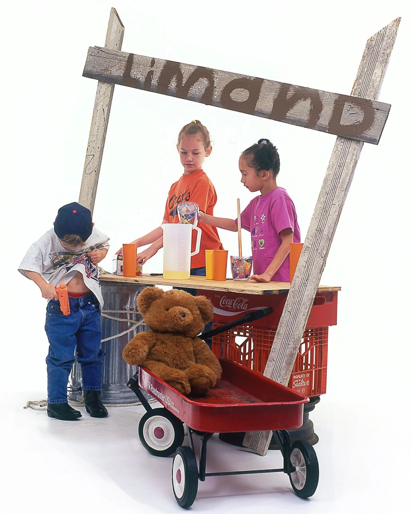 Children operating a lemonade stand in a commercial lifestyle photograph.