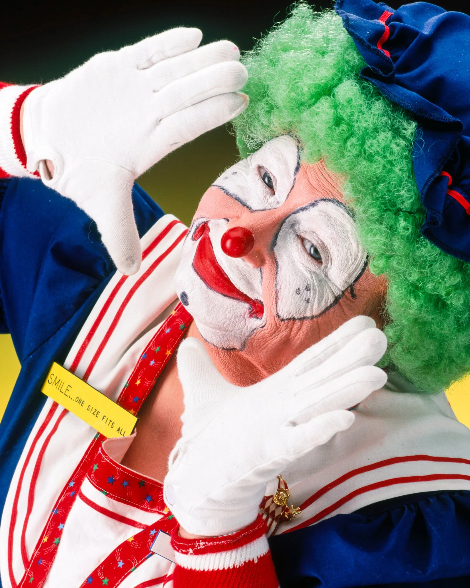 Clown performer posing for a colorful editorial portrait.