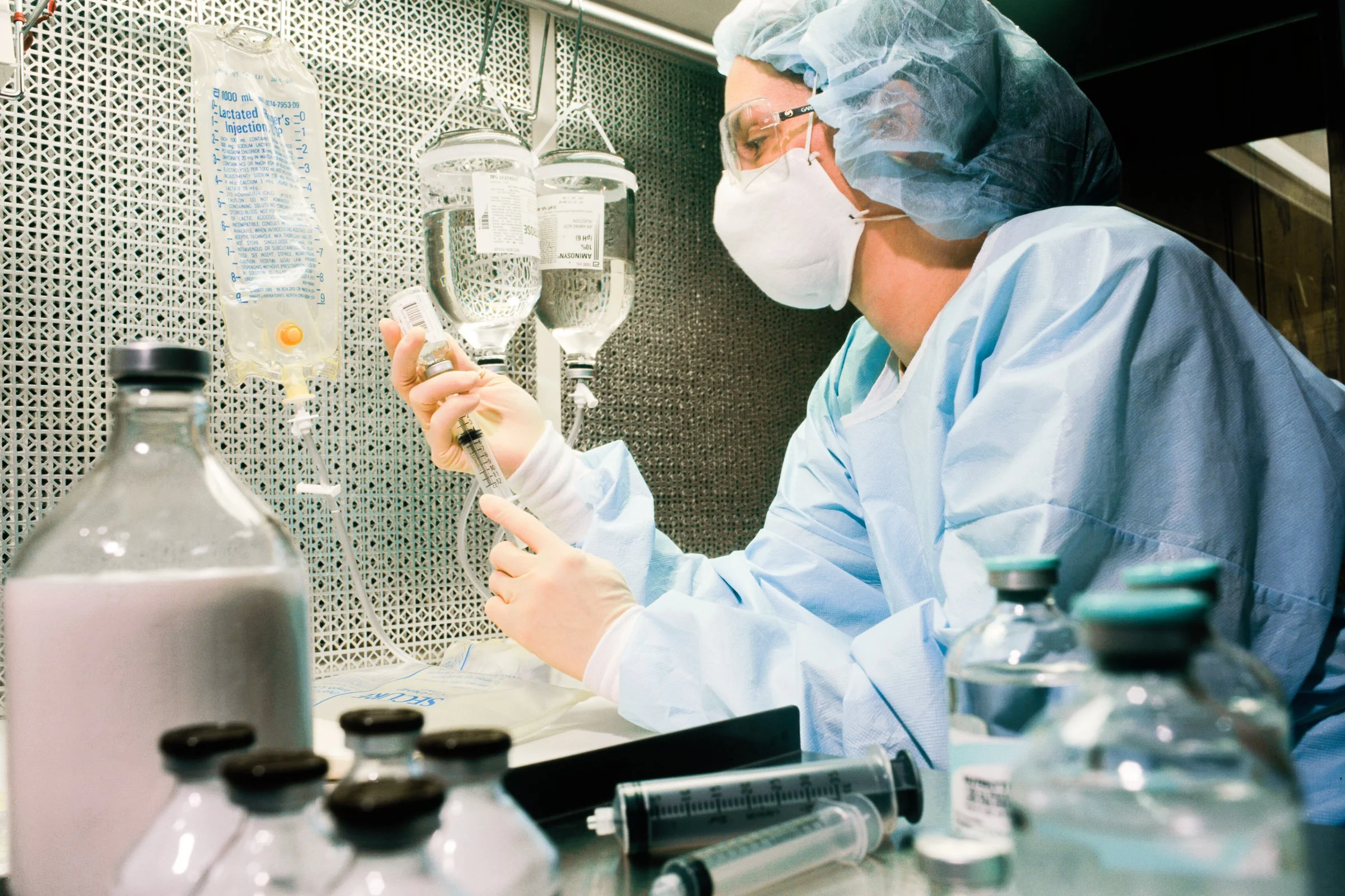 Healthcare professional working with cancer treatments.