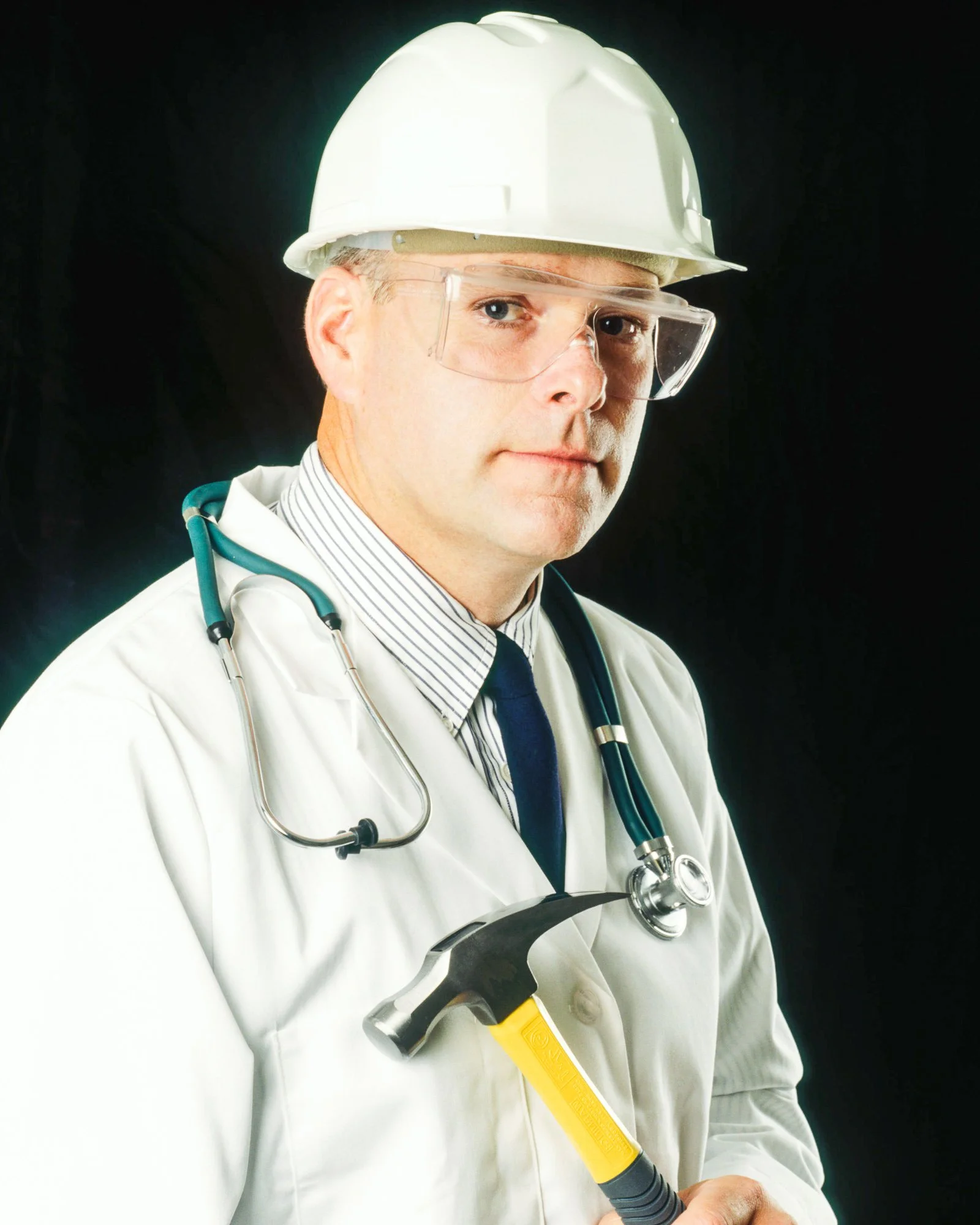 Medical professional wearing a hard hat and stethoscope contradicting bedside manner.