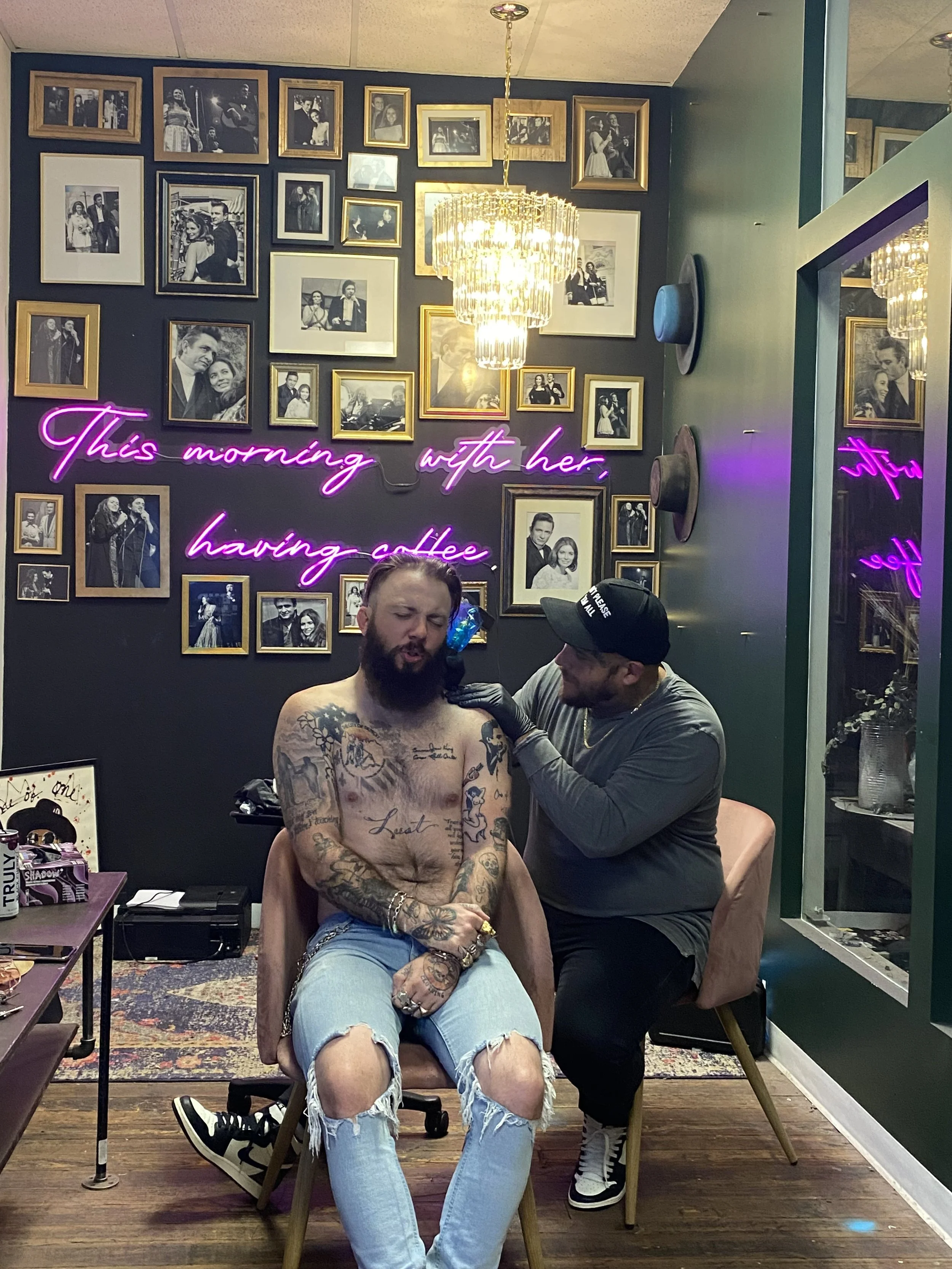 Austin tattooing Travis Austin (fashion designer and painter)