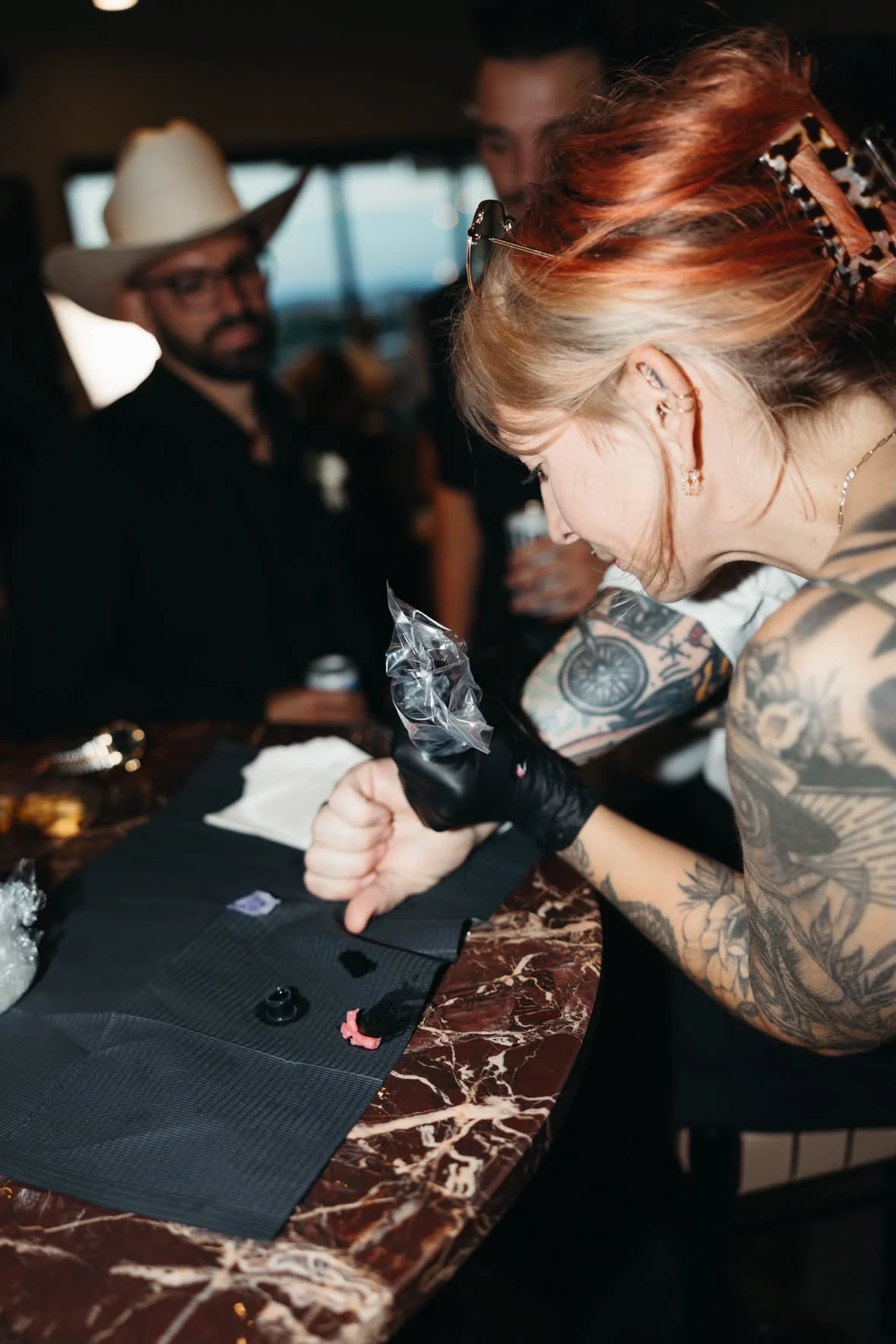 Brittany tattooing at the Crosses' wedding