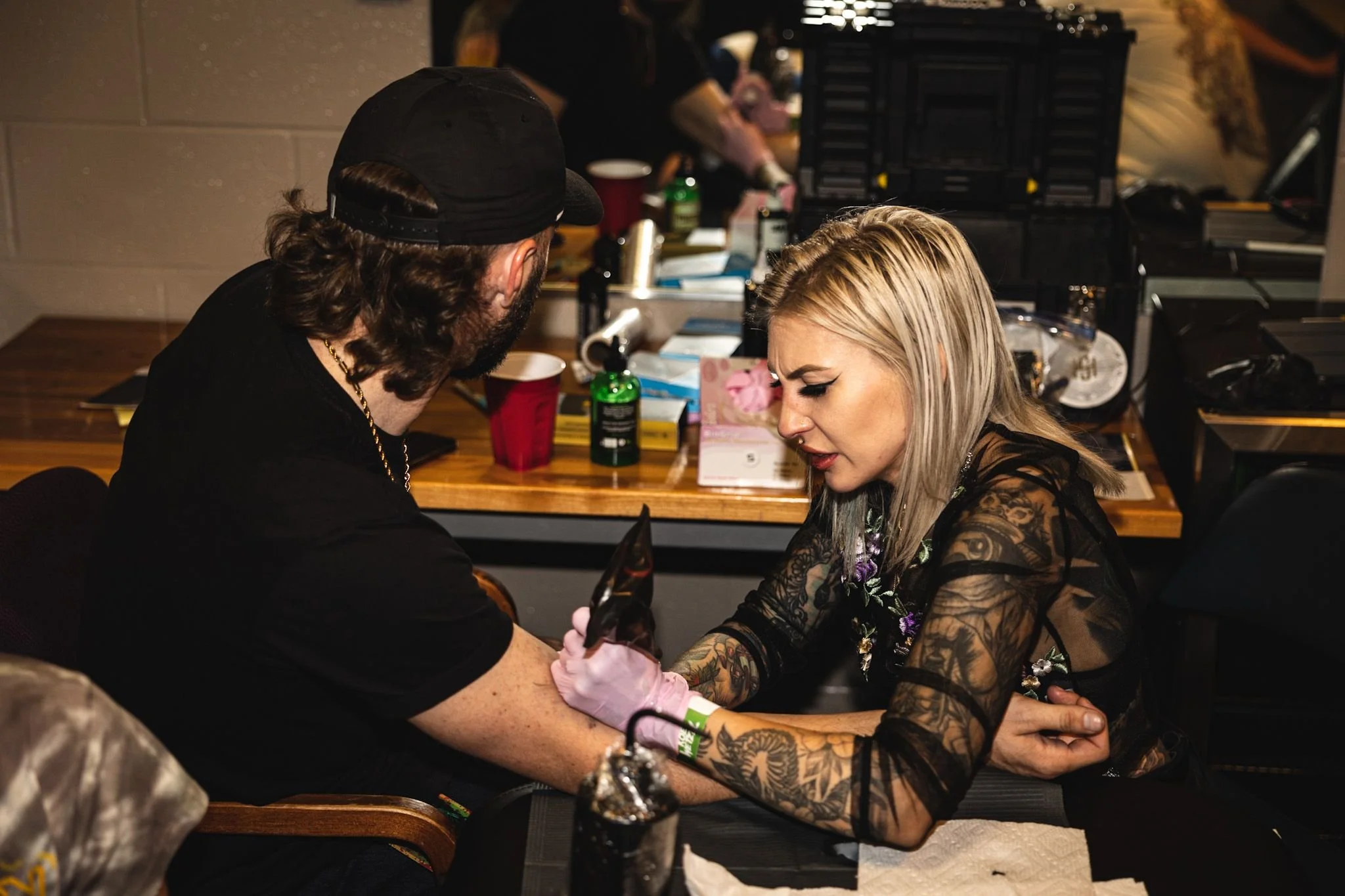 Brittany tattooing country singer, Dylan Wheeler