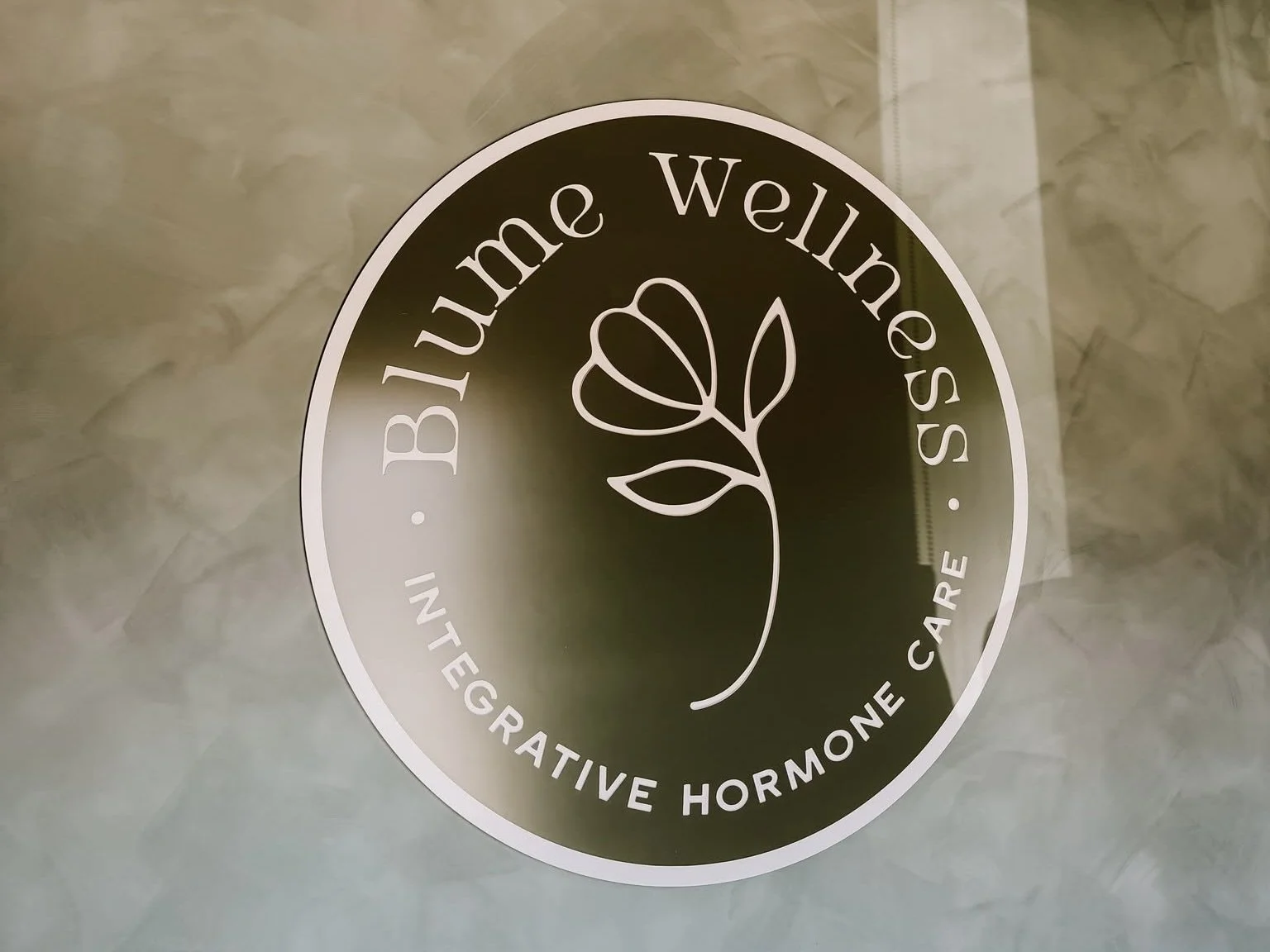 A Blume Wellness logo.