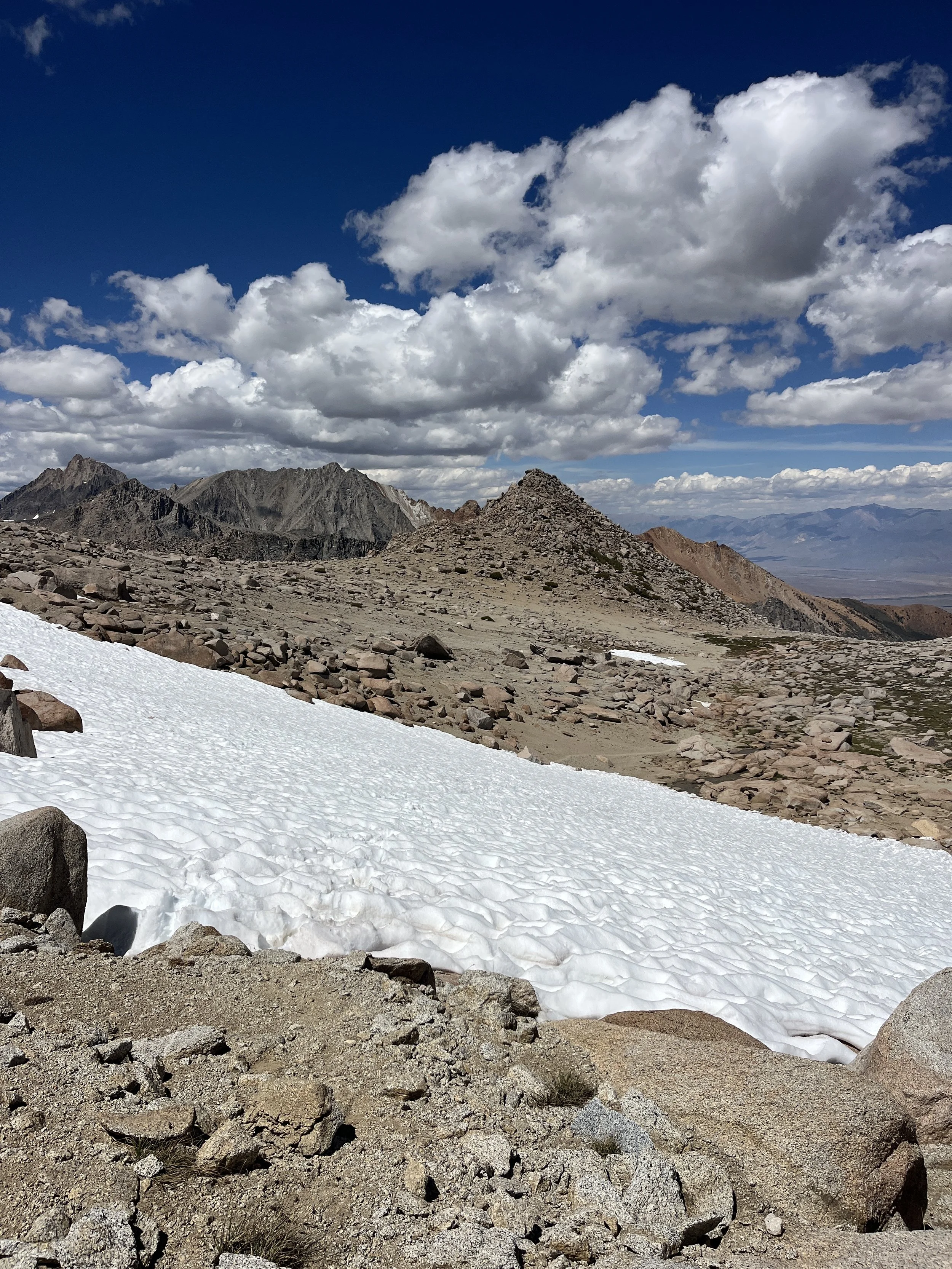 Snow patches below col.