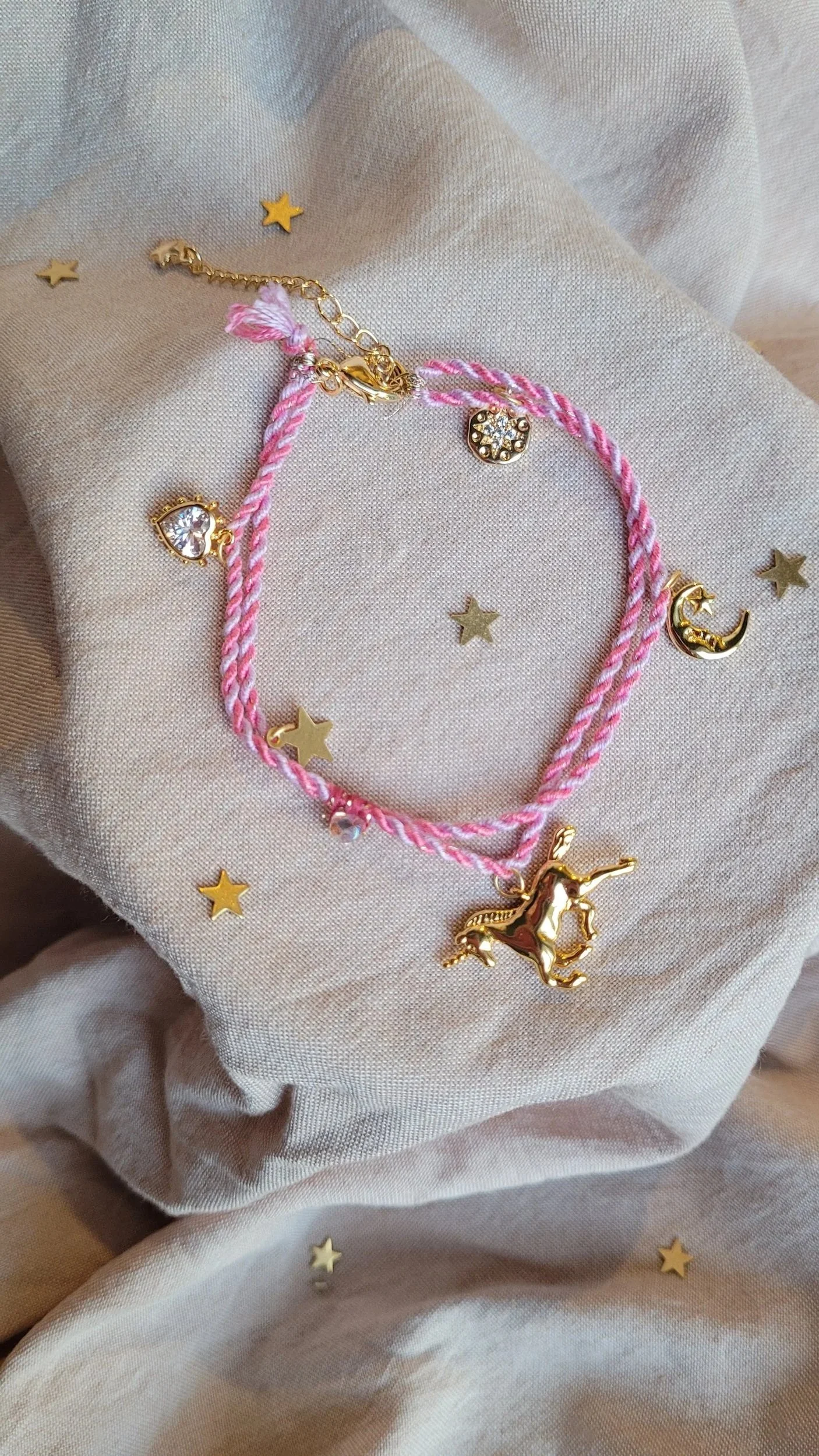 Twisted cord charm bracelet (pink and lilac with gold tone charms)