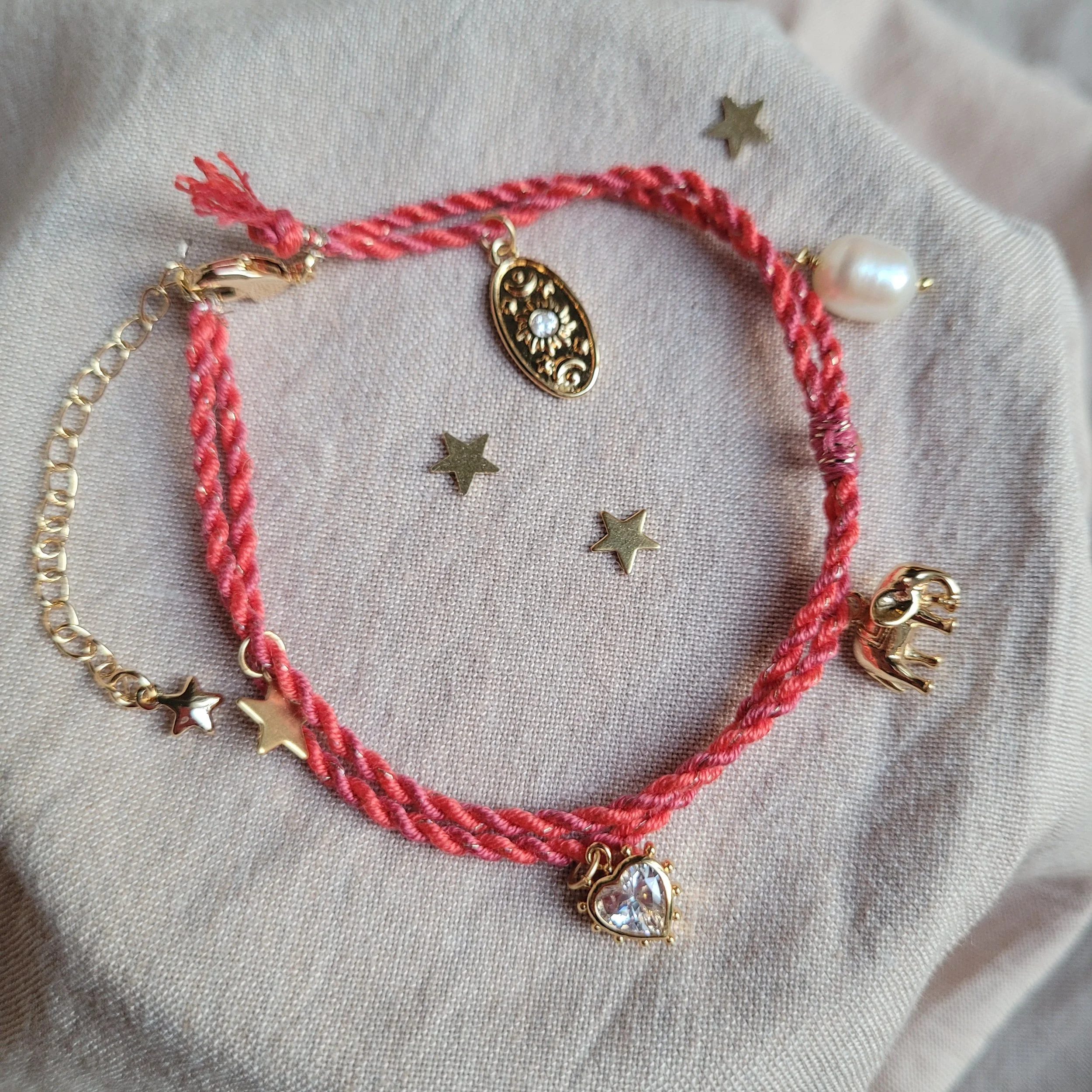 Twisted cord charm bracelet (bright pink and coral with gold tone charms)