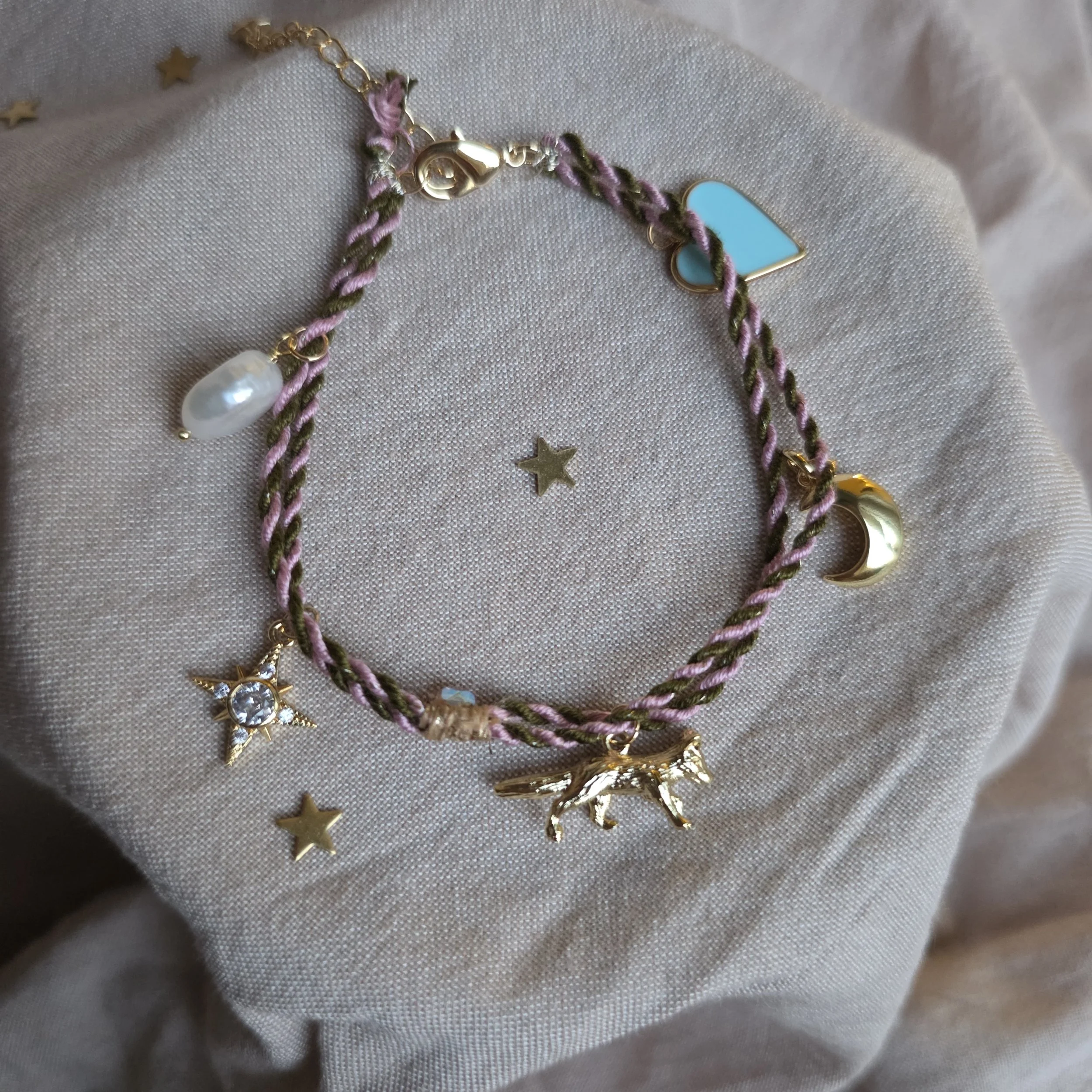 Twisted cord charm bracelet (green and pink with gold tone charms)