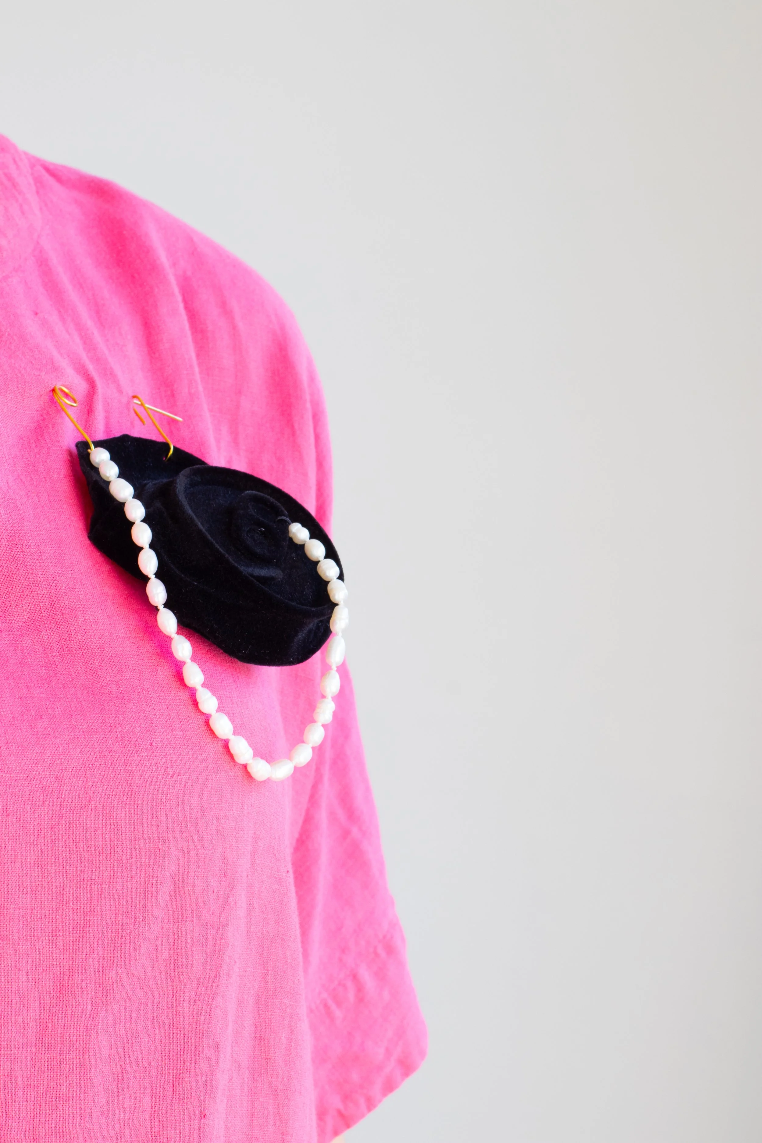 Positioning Yourself with Pearls in Black, 2024, Found aluminium can, nylon flock, brass, freshwater pearls, silk