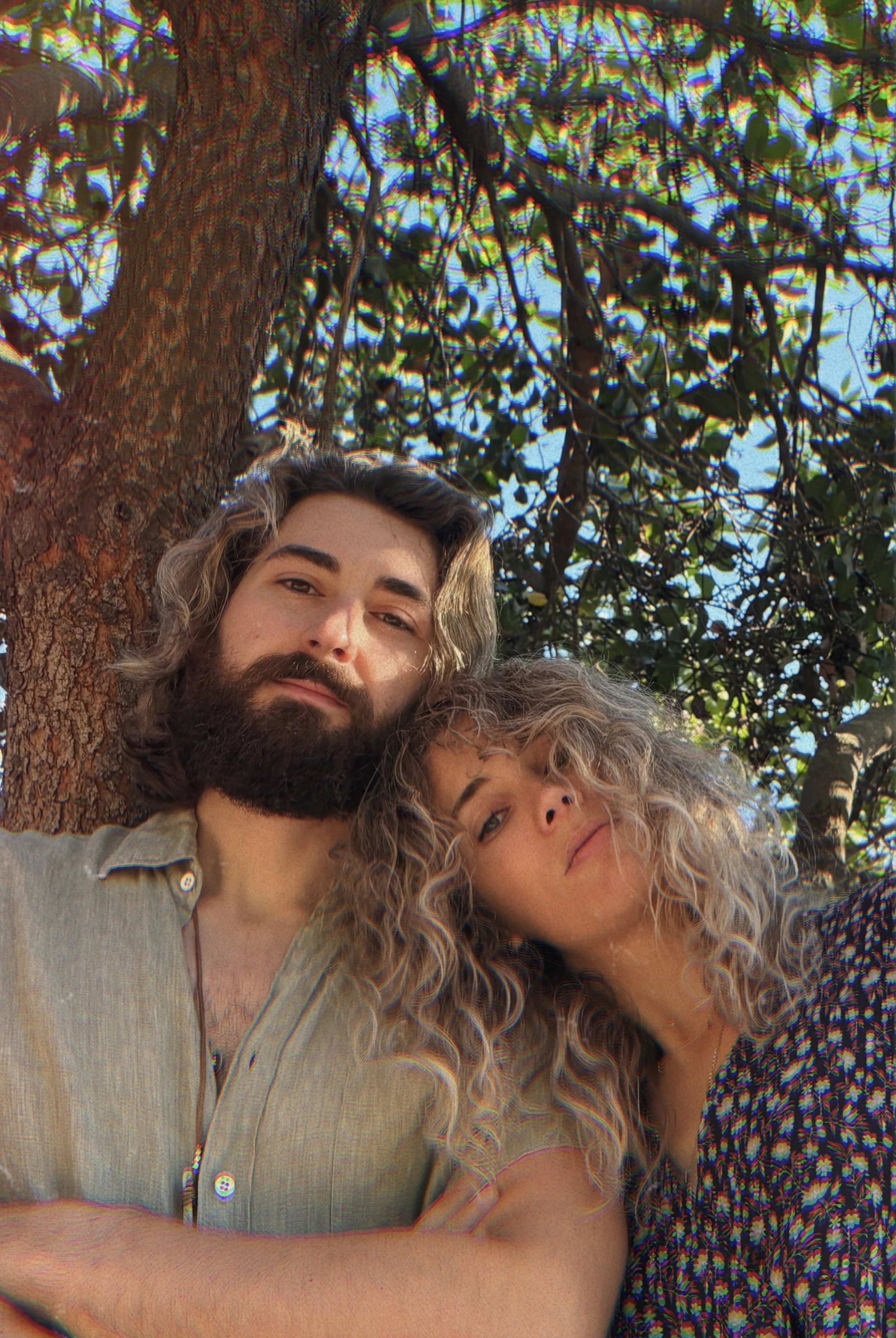 Bel Mercy together beneath a tree during a Laurel Canyon promotional photoshoot.