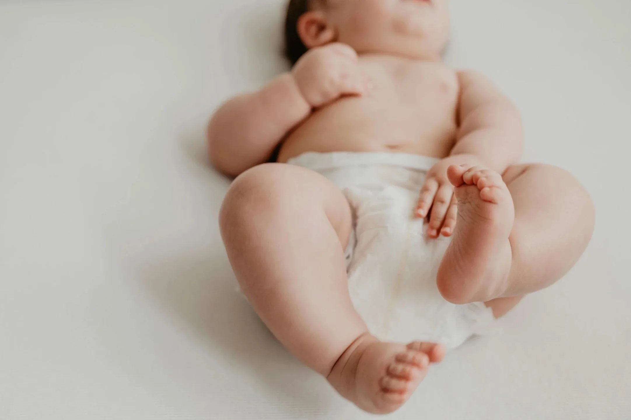 Huddle newborn, supported by Chicago IL & NY nurses.