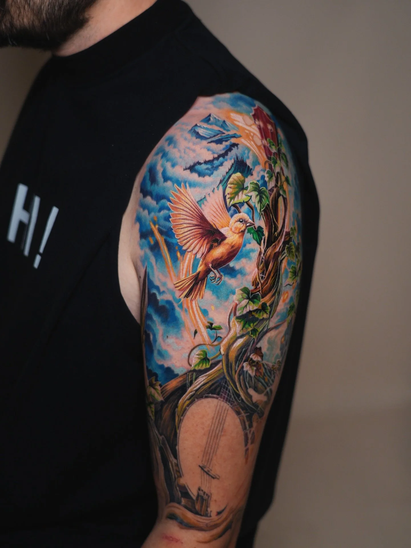After 24+ hours in the chair over the last couple of weeks, I finally brought to life a tattoo I&rsquo;ve dreamed about for years: a fiery banjo blooming into a tree, with a canary and mountain backdrop. It&rsquo;s more than just ink, it&rsquo;s a pi