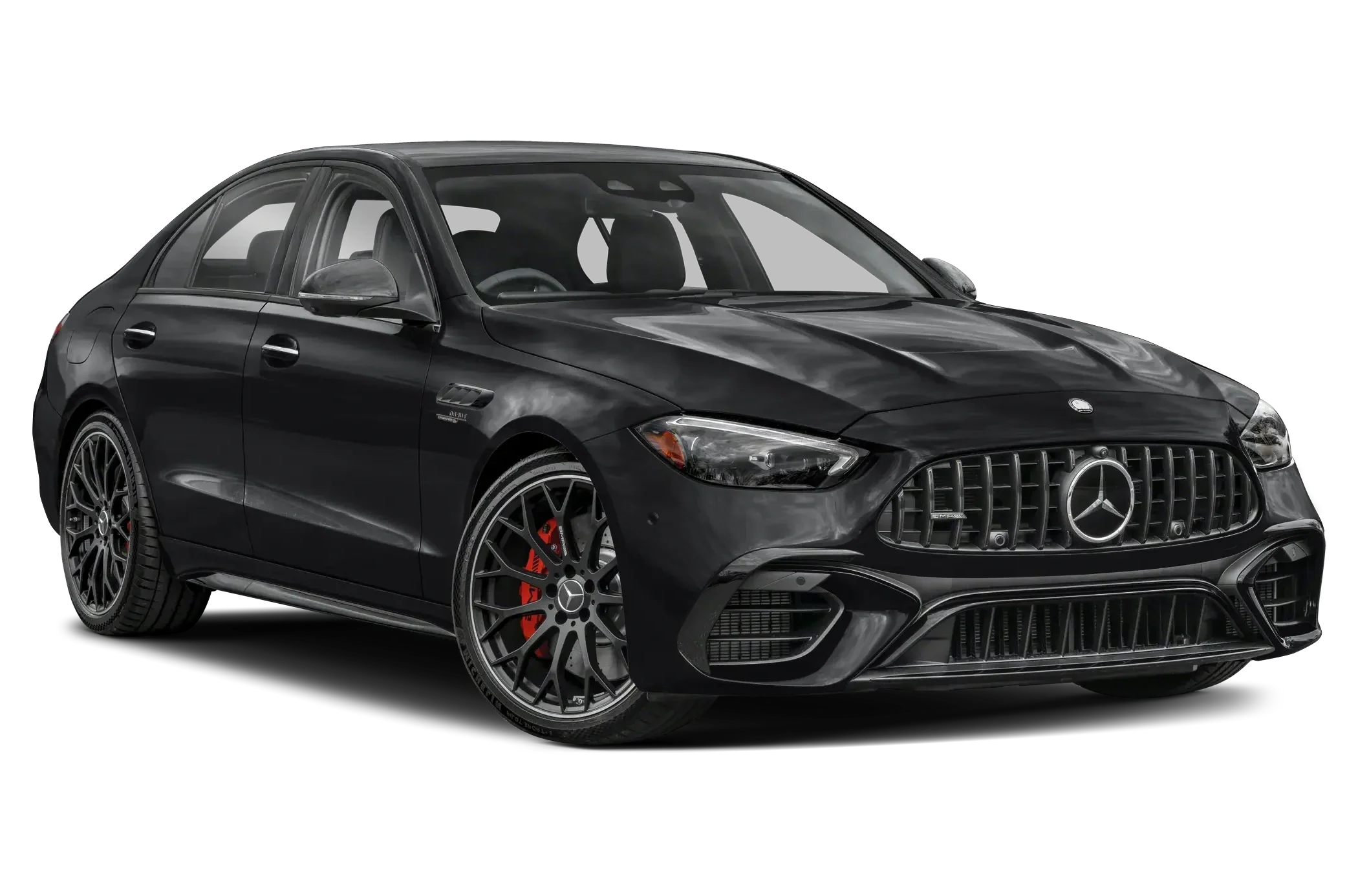 A black Mercedes Benz luxury sedan with sporty design, alloy wheels with red brake calipers, and a front grille with the Mercedes logo.