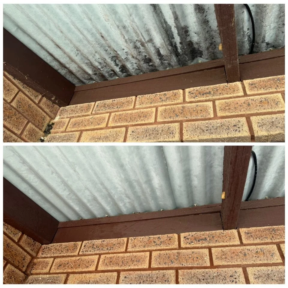 Comparison of the corner of a building's exterior showing a rusty metal roof, a wooden beam painted brown, and brick wall, with the top image having rust stains and dirt on the metal roof, and the bottom image showing a cleaned metal roof.