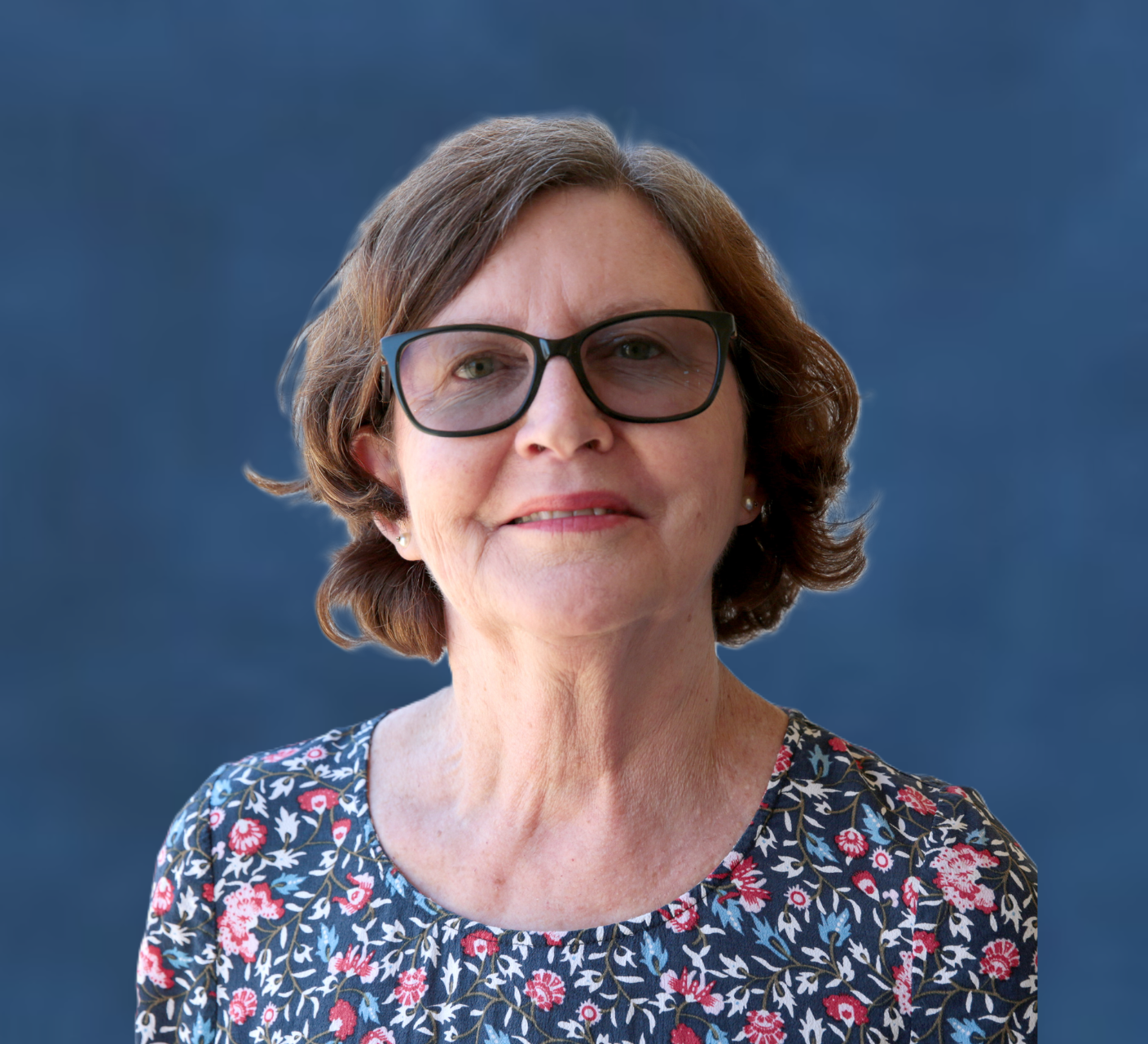 Silhouette of a person's head and shoulders against a dark gradient background.