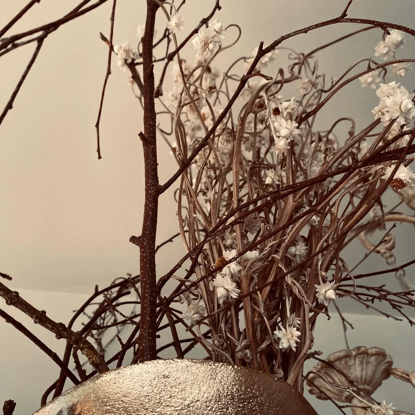 Dried flowers from @fleurs_de_lyonville and branches from South Melbourne in a golden vessel from @freedom_australia