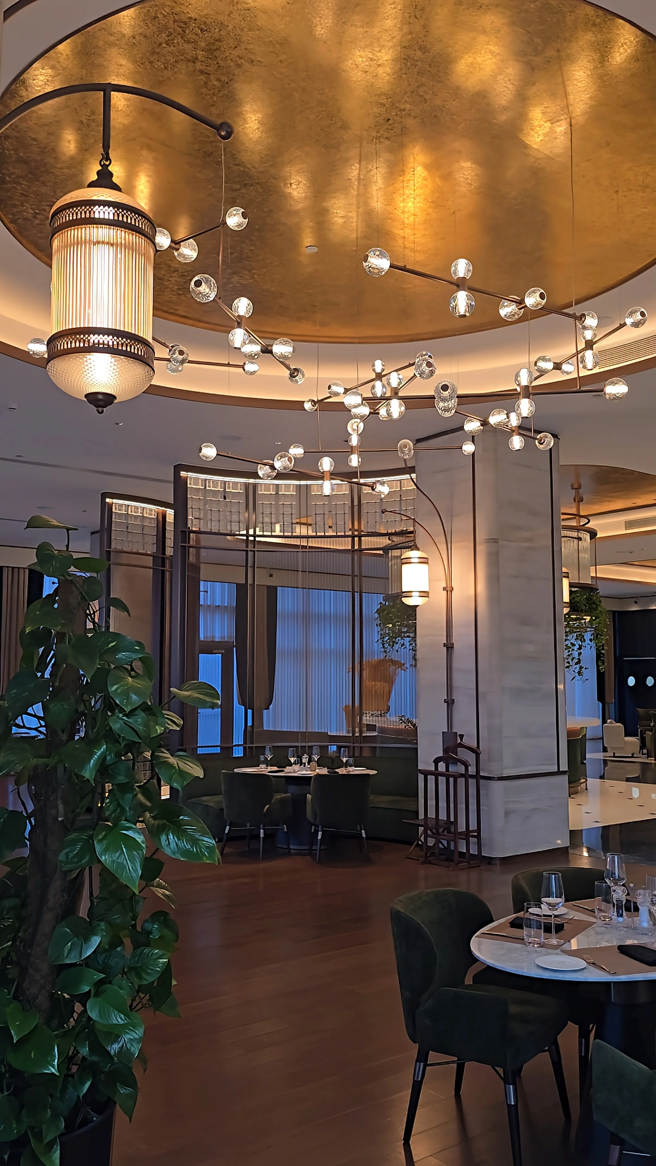 Sophisticated restaurant interior featuring designer lighting, marble finishes, and contemporary dining spaces at JW Marriott Hotel Tashkent