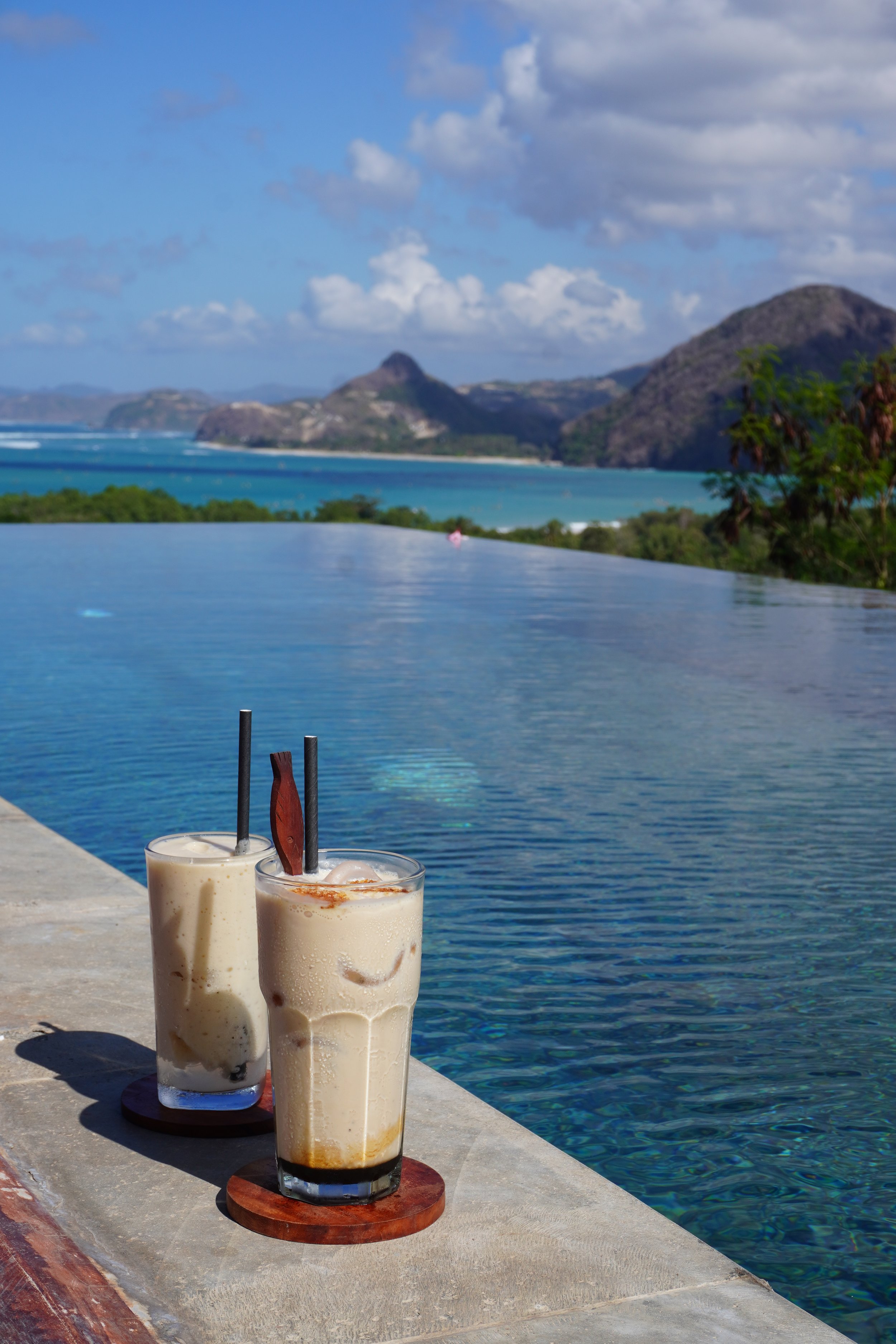 Refreshing iced coffees served beside the infinity pool with sea views
