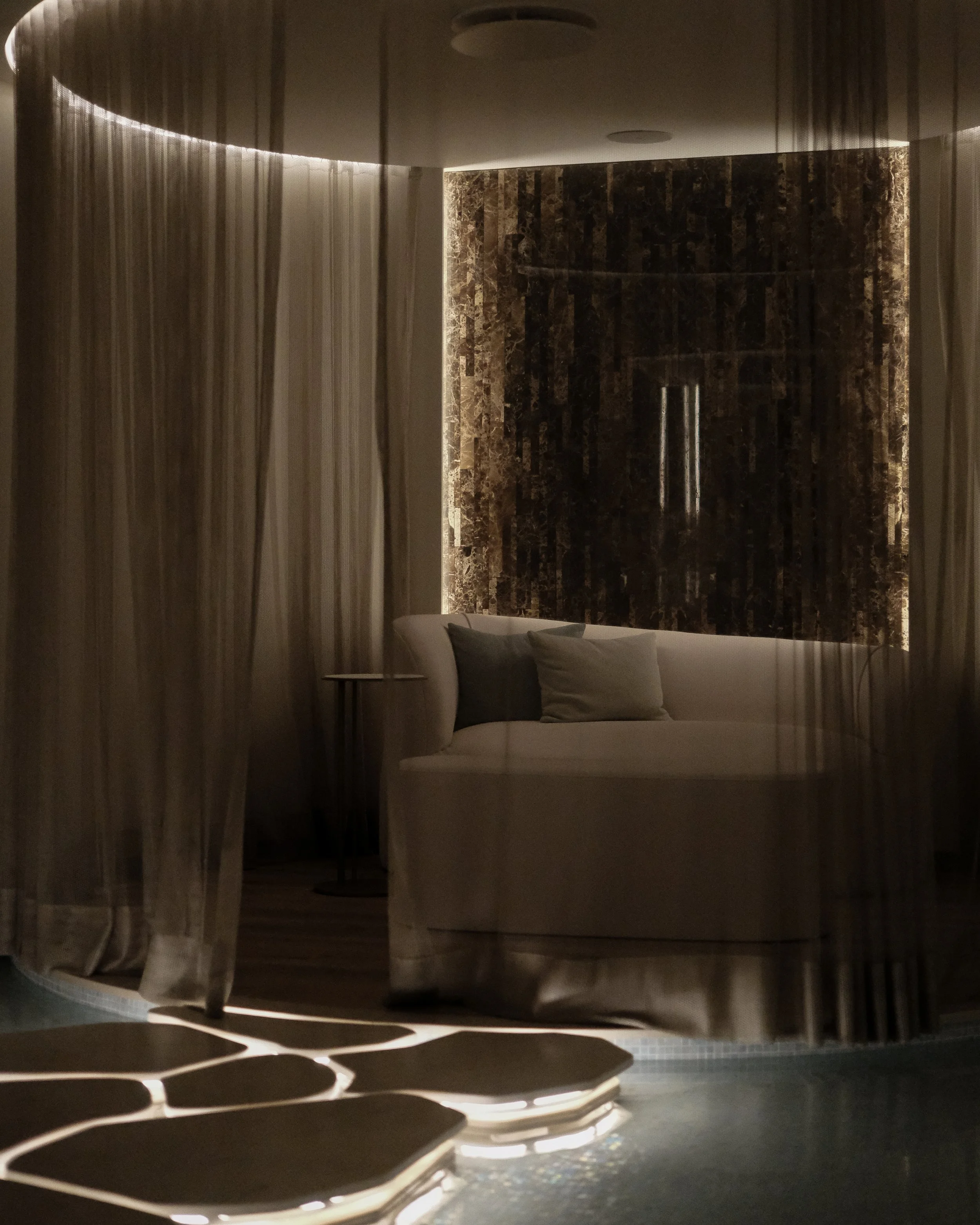 Dimly lit spa ambiance with a curved sofa, sheer drapery, and glowing water features — Hyatt Regency Lisbon
