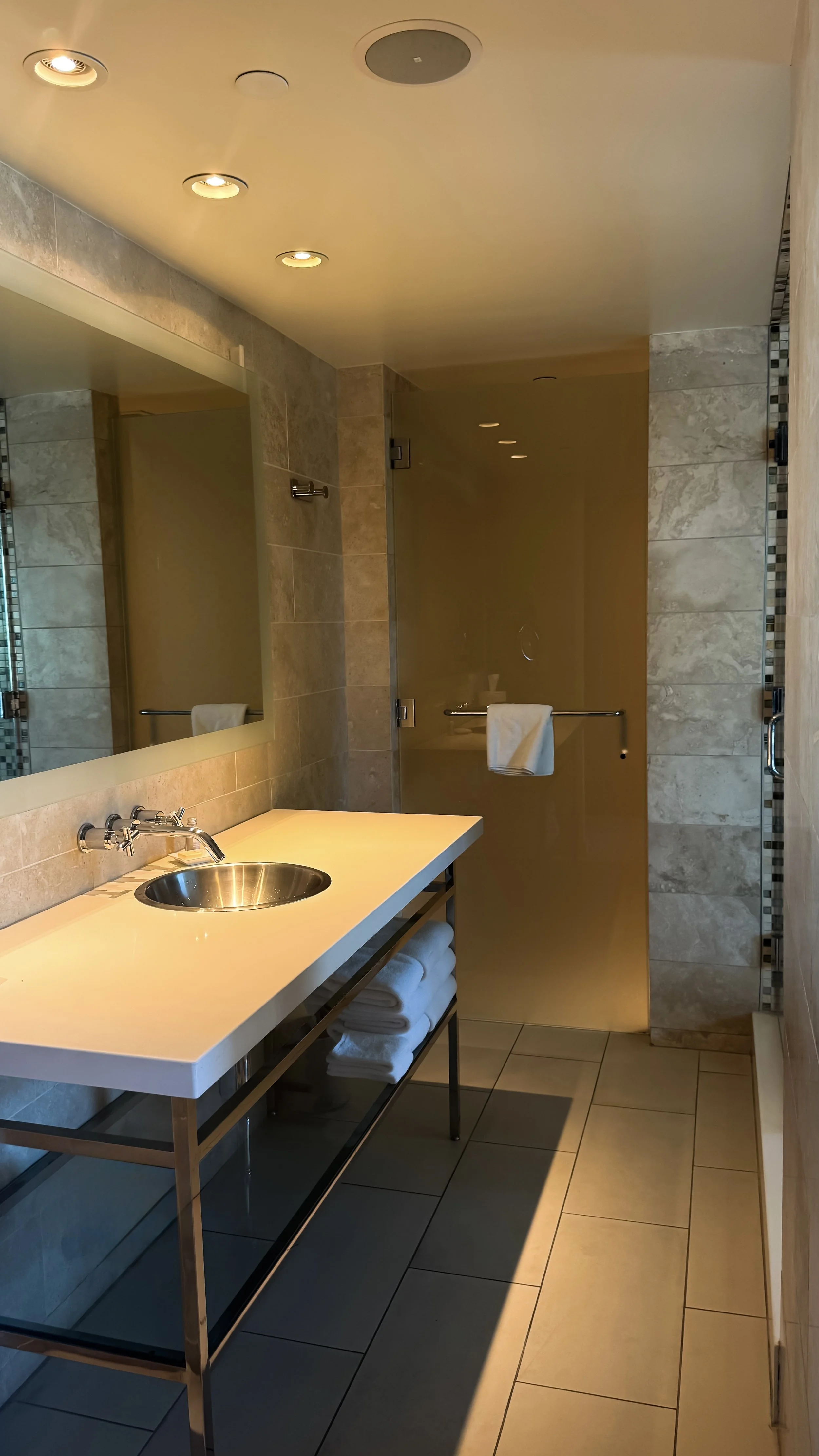 Modern bathroom with walk-in shower, marble finishes, and sleek vanity design, Andaz San Diego – San Diego, California.