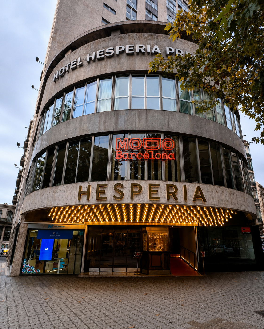 Elegant hotel façade illuminated along Barcelona's iconic Avenida Diagonal