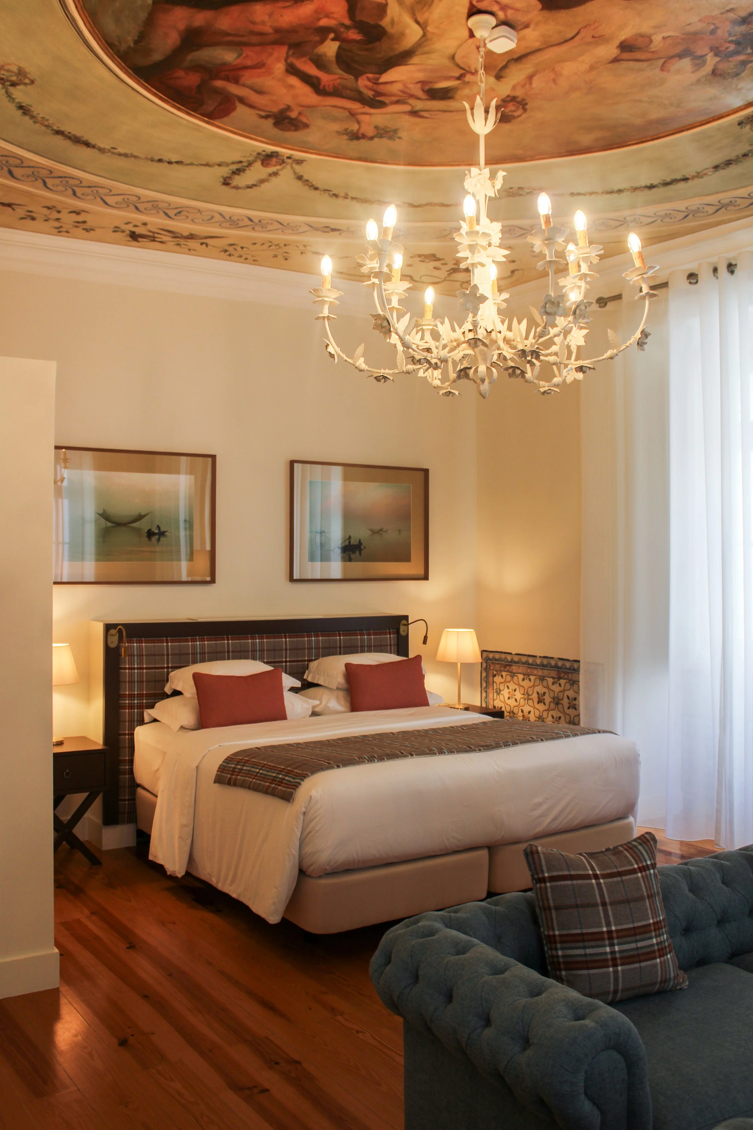 Spacious guest room with restored fresco ceiling, elegant furnishings and boutique hotel charm at Once Upon Lisboa