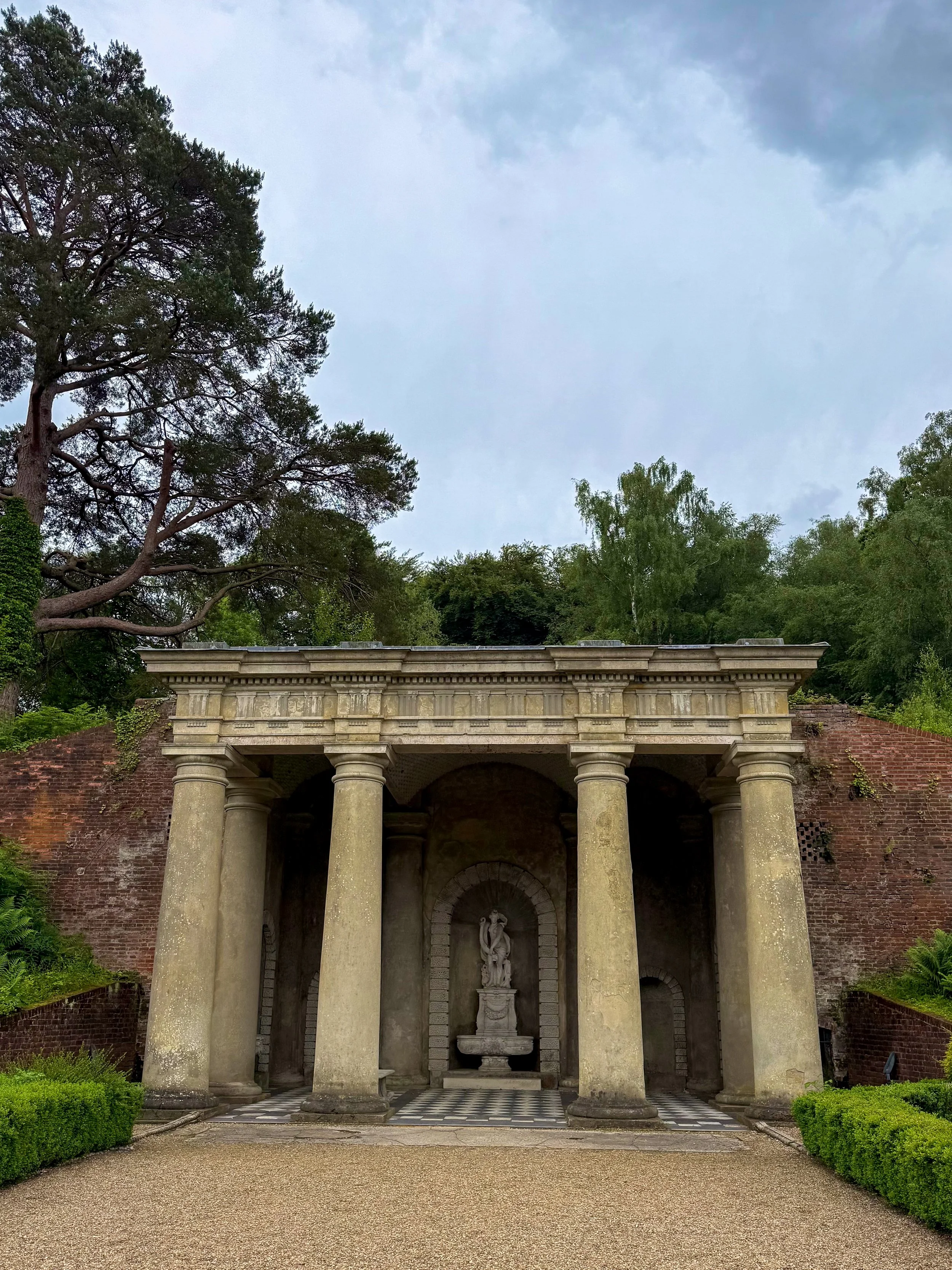 Historic Roman-style temple nestled within beautifully landscaped English gardens