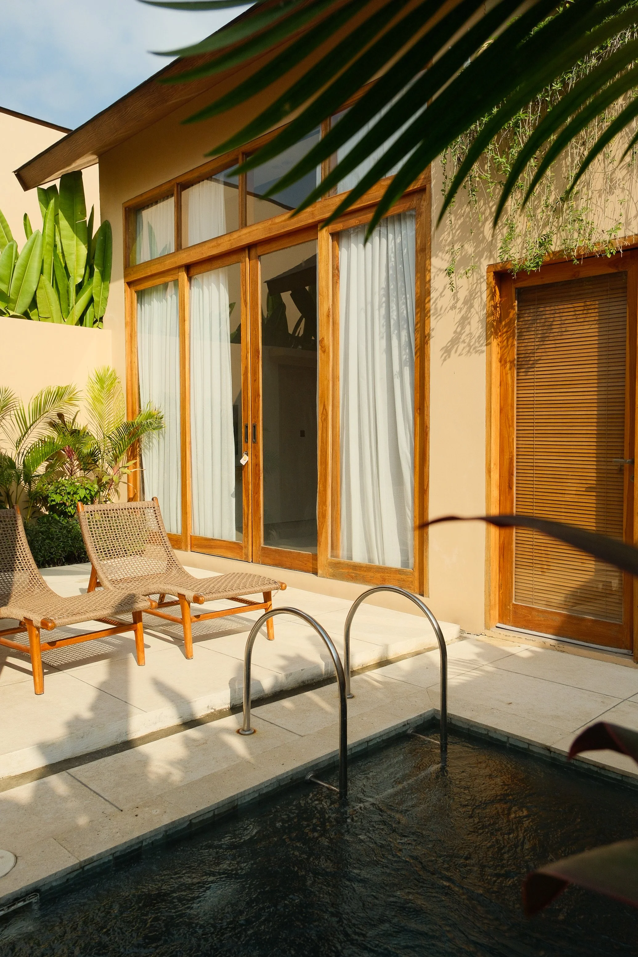 Private villa terrace with plunge pool and tropical outdoor seating
