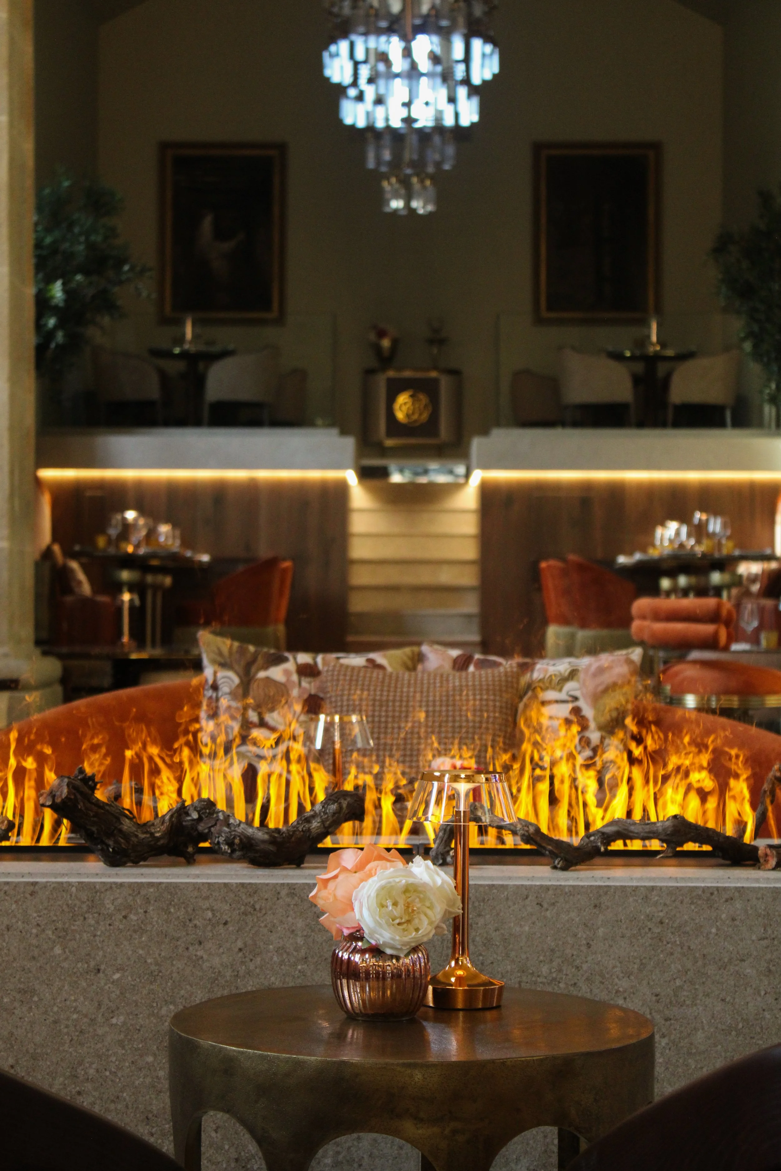 Cozy fireplace lounge with elegant seating and ambient lighting at Convento do Seixo, Portugal