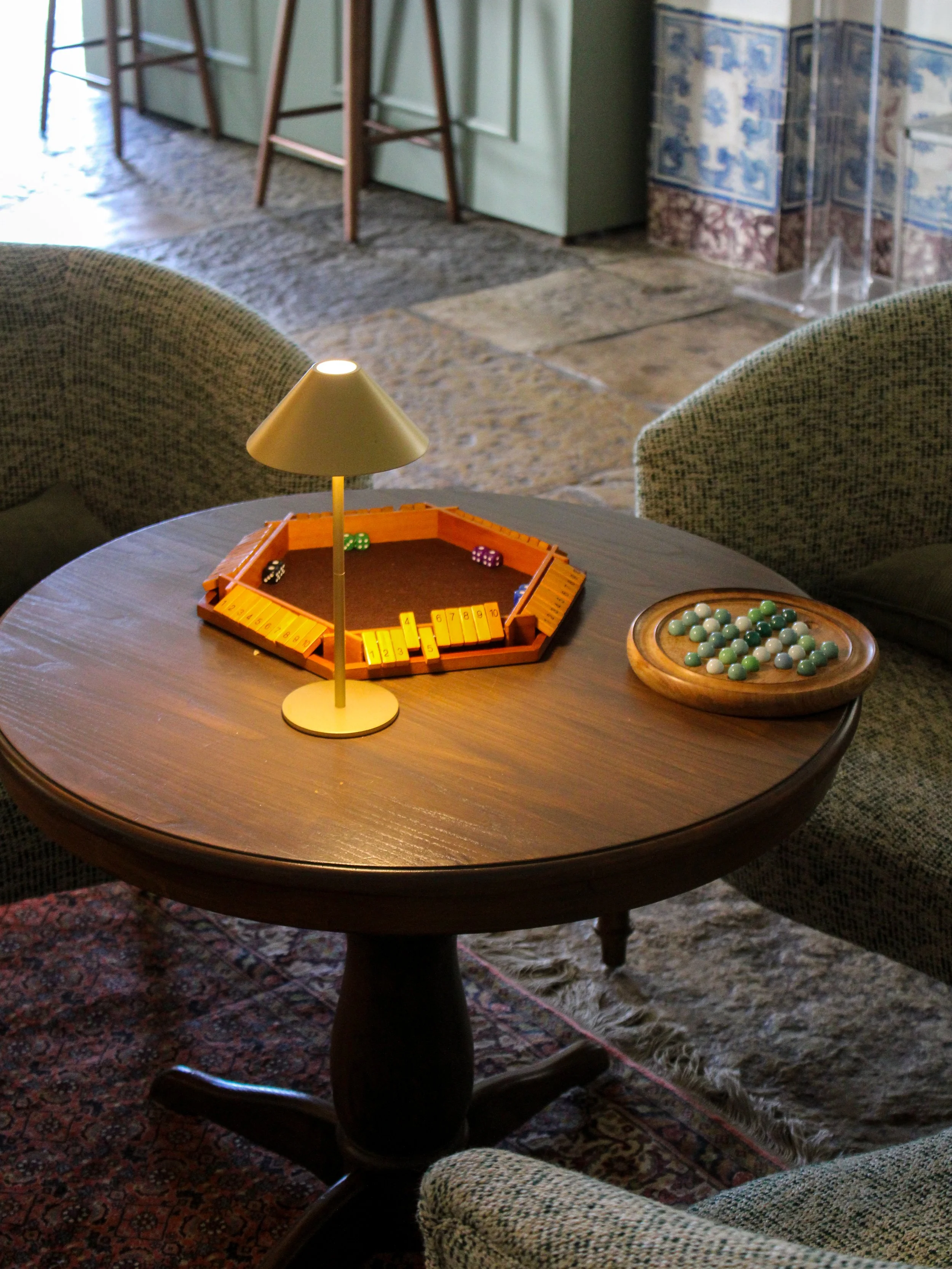 Cozy games lounge featuring board games and intimate seating areas inside the historic estate at Hotel Casa Palmela