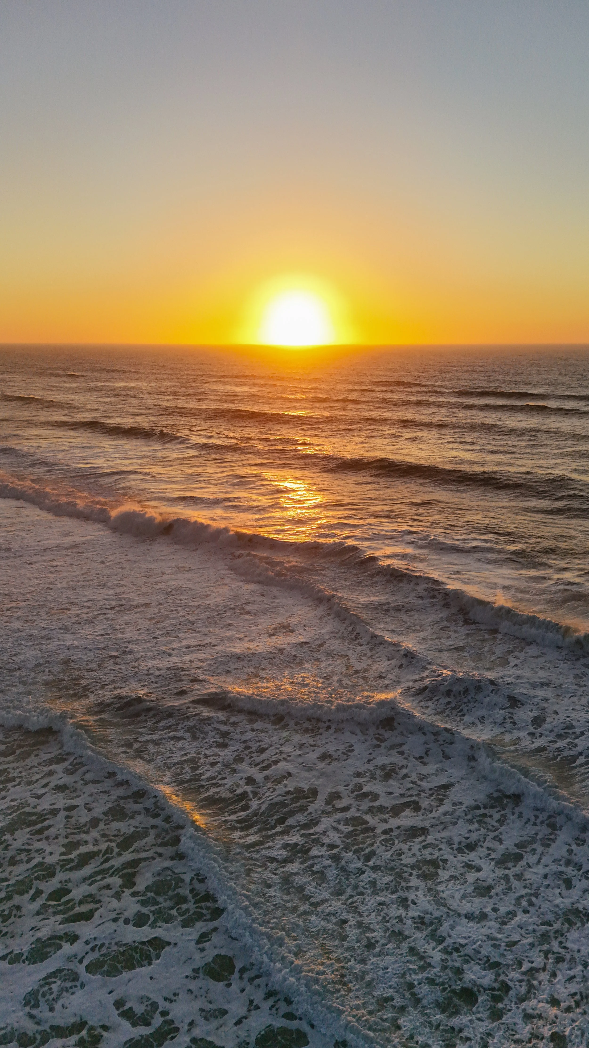 Golden sunset over the Atlantic Ocean viewed from Arribas Hotel on Portugal’s dramatic west coast