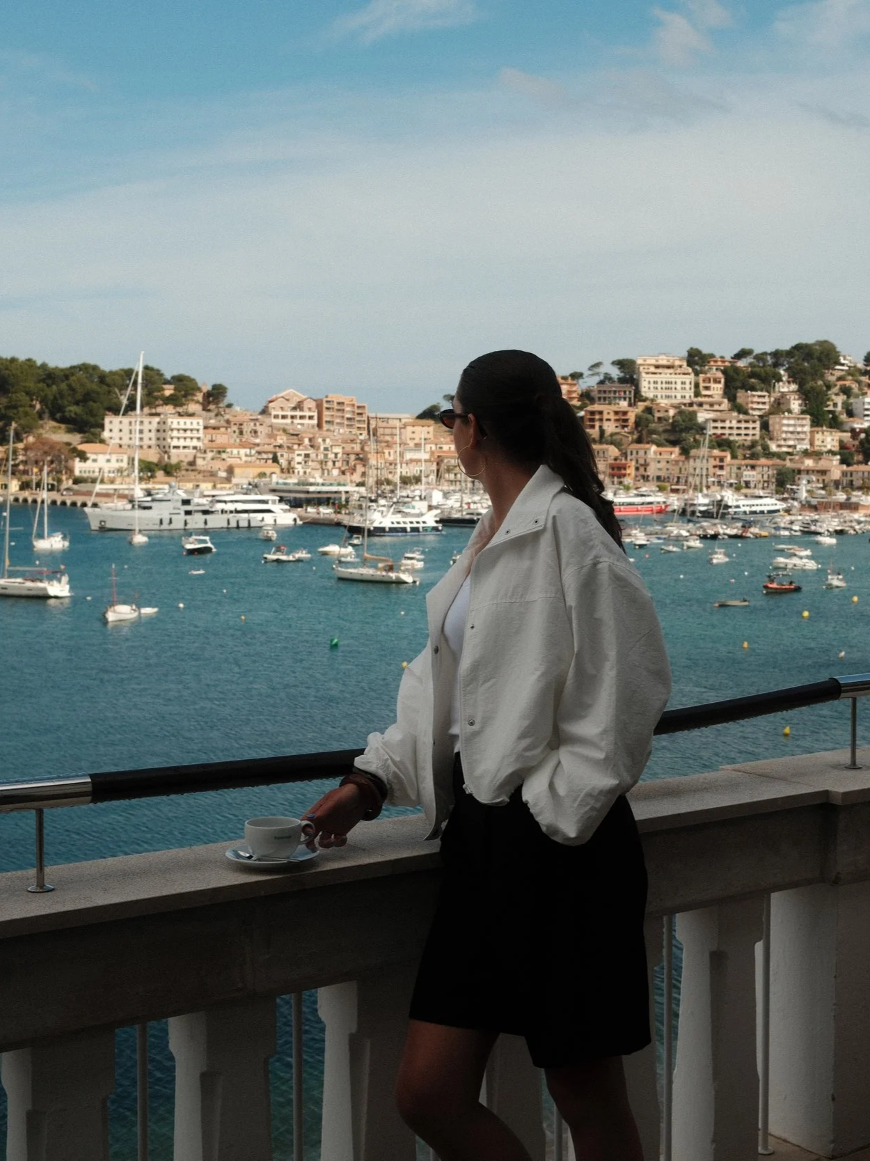 Guest enjoying morning coffee with panoramic views over Port de Sóller and the marina
