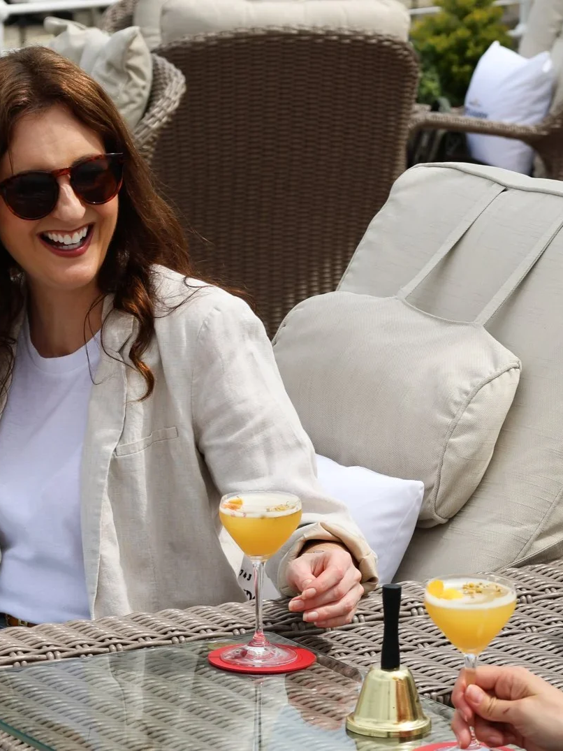 Two Guests relaxing and enjoying cocktails outdoors