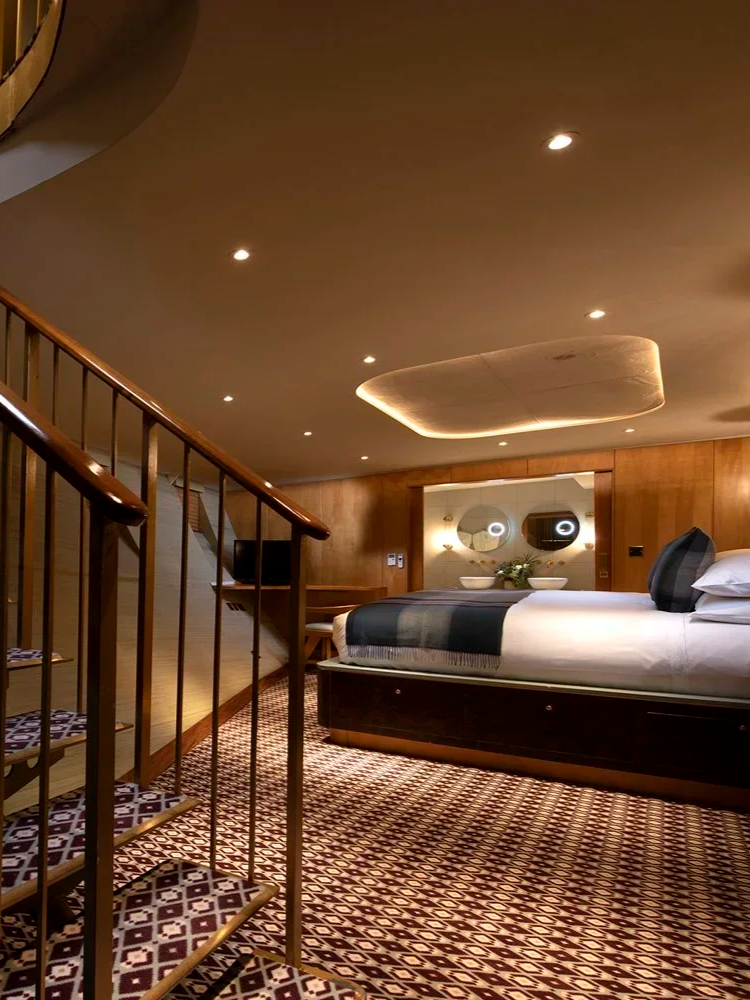 Duplex luxury cabin with spiral staircase aboard Fingal Hotel in Edinburgh
