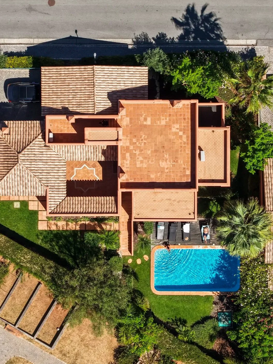 Aerial view of a luxury villa with private swimming pool at Amendoeira Golf Resort in Algarve