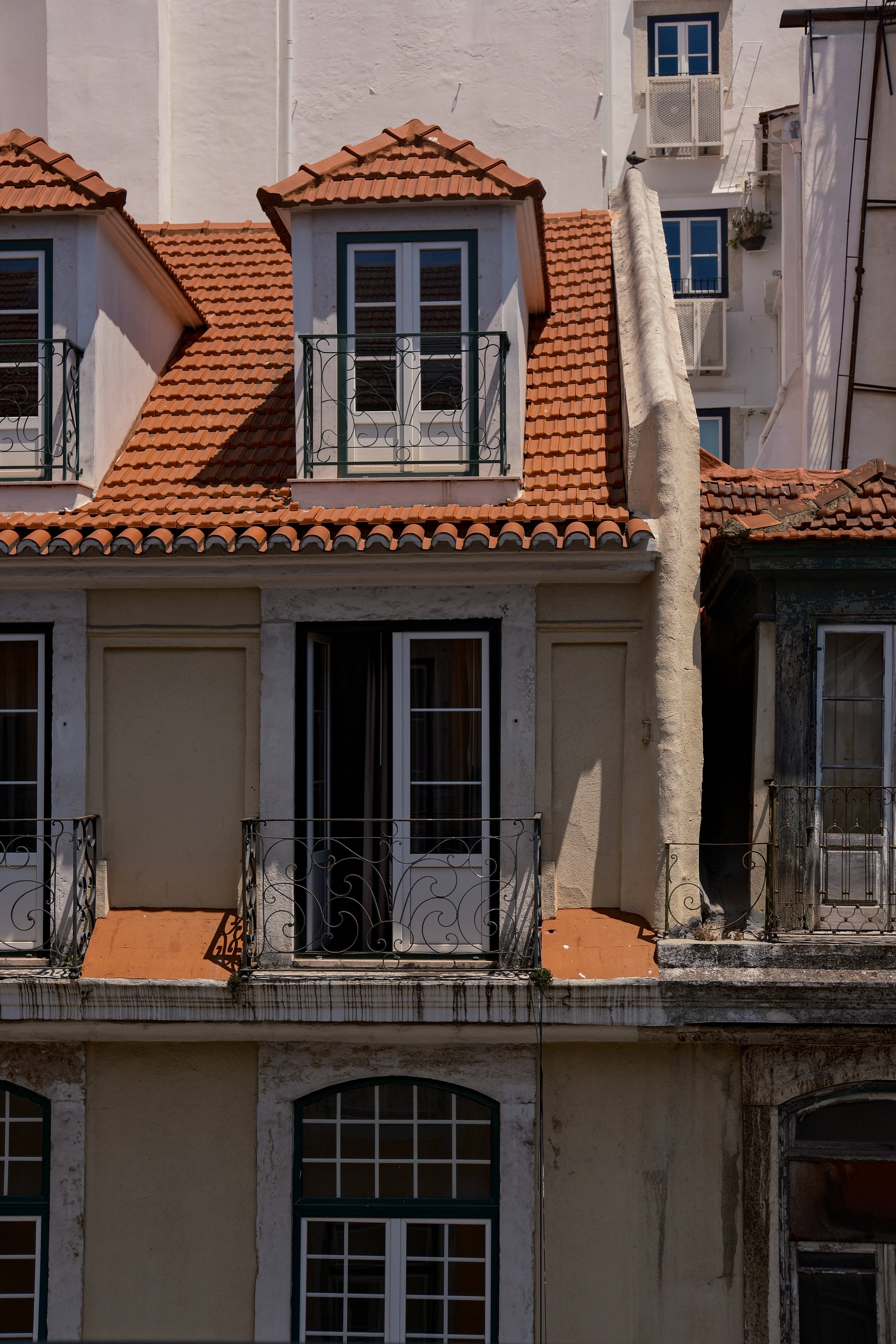 Traditional Lisbon rooftops viewed from a private apartment balcony