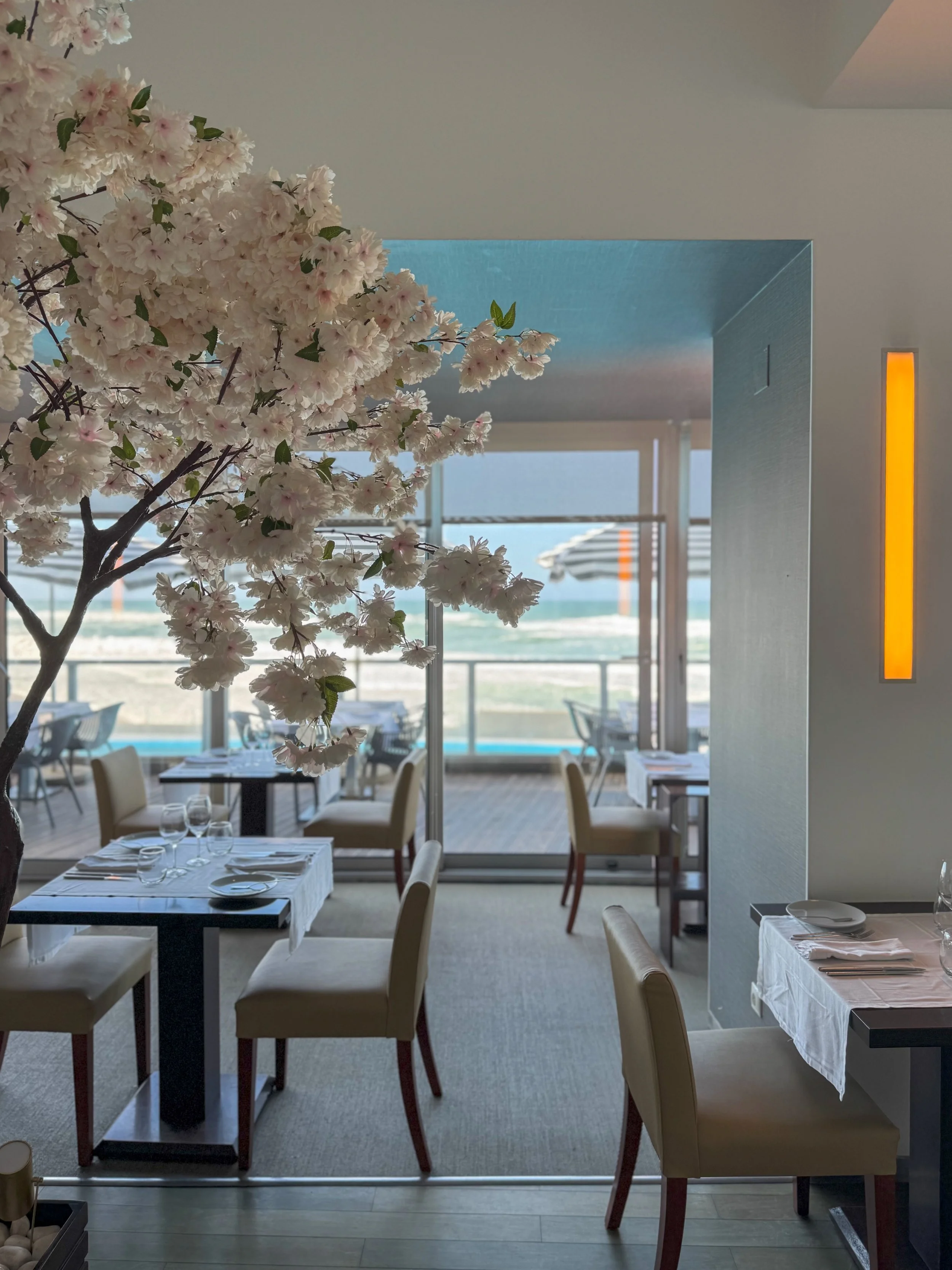 Bright restaurant with Atlantic Ocean views serving refined Portuguese cuisine at Arribas Hotel