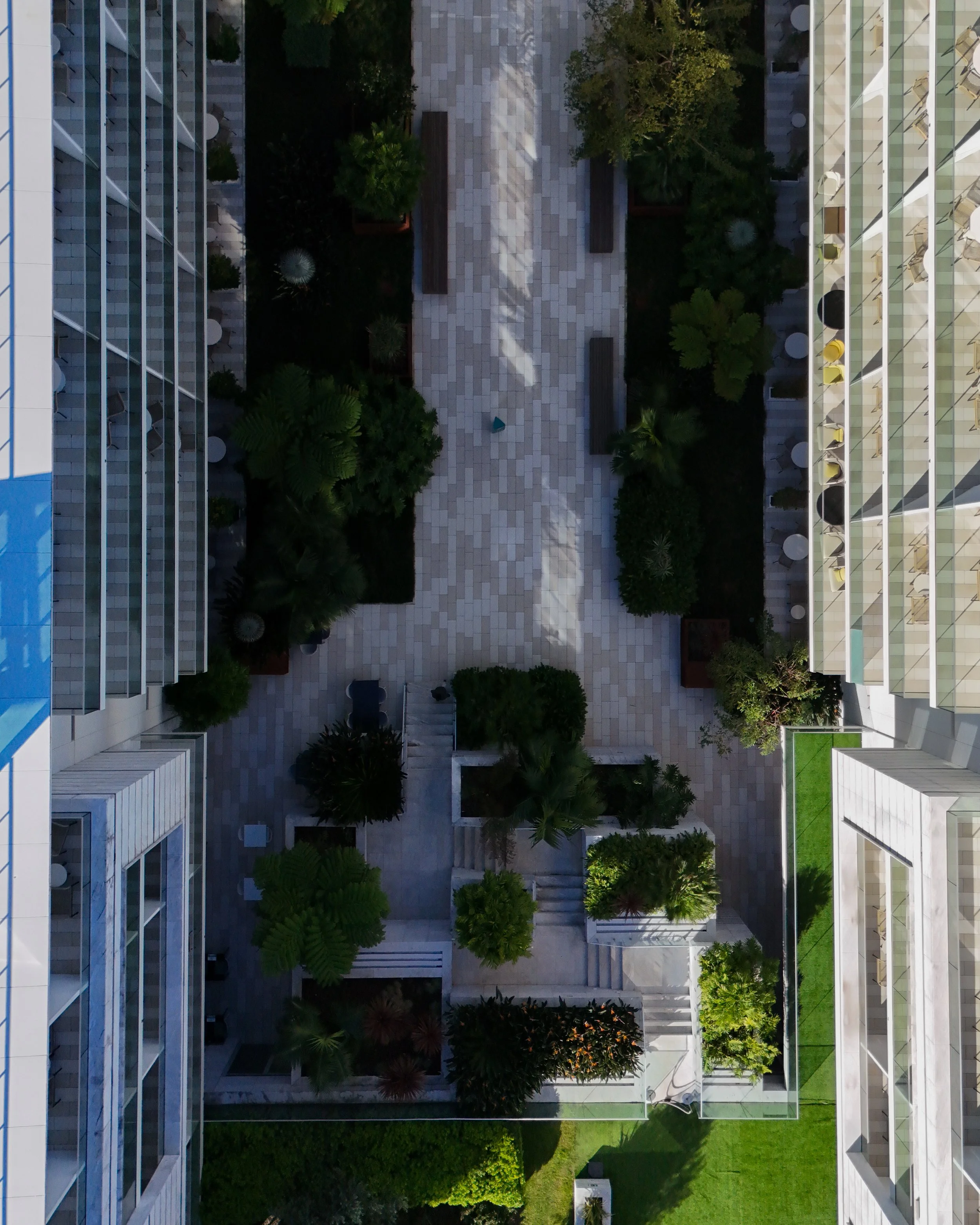 Symmetrical aerial view of Hyatt Regency Lisbon’s landscaped courtyard and contemporary architecture