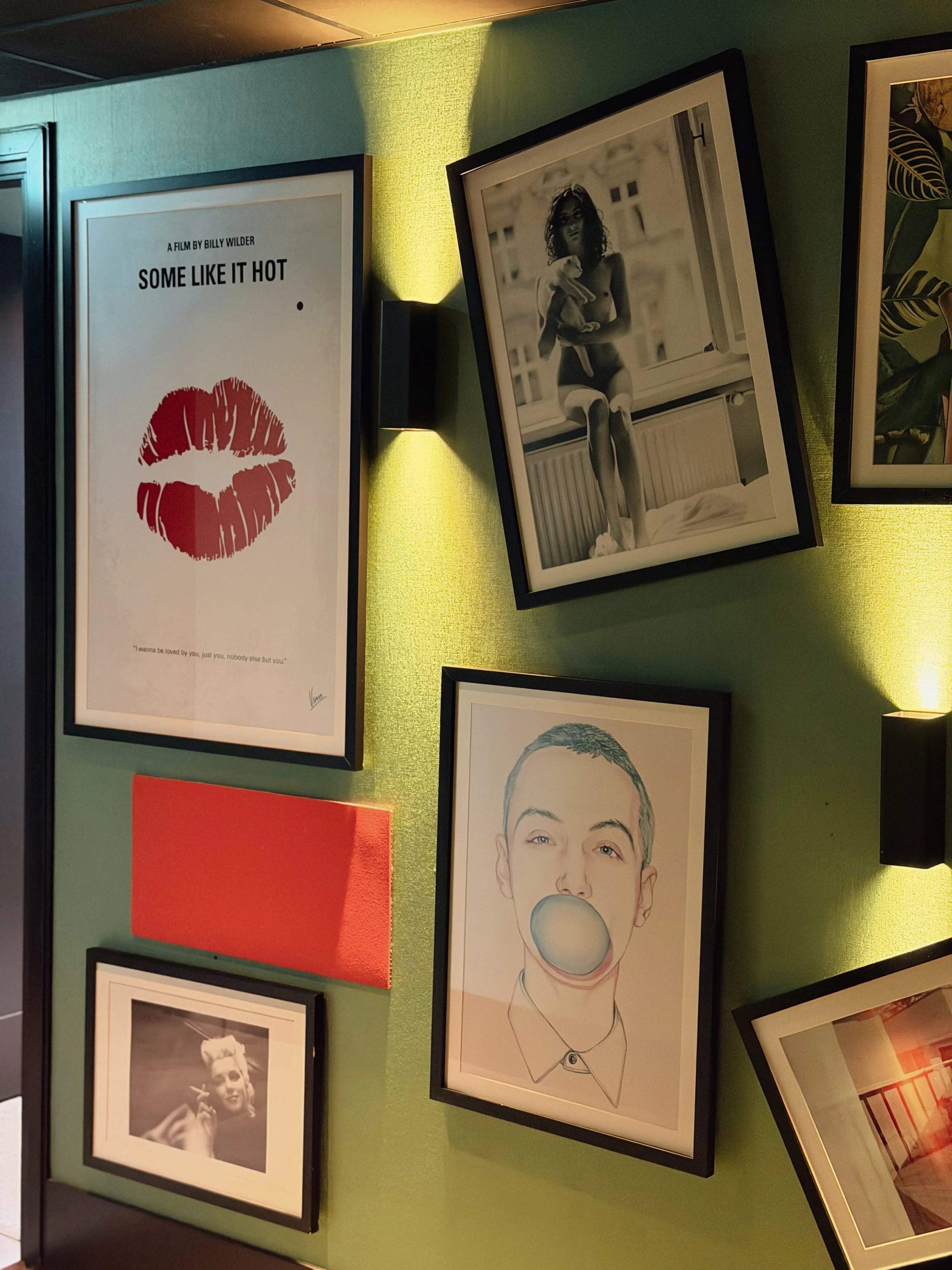 Contemporary hotel corridor featuring curated artwork and ambient lighting
