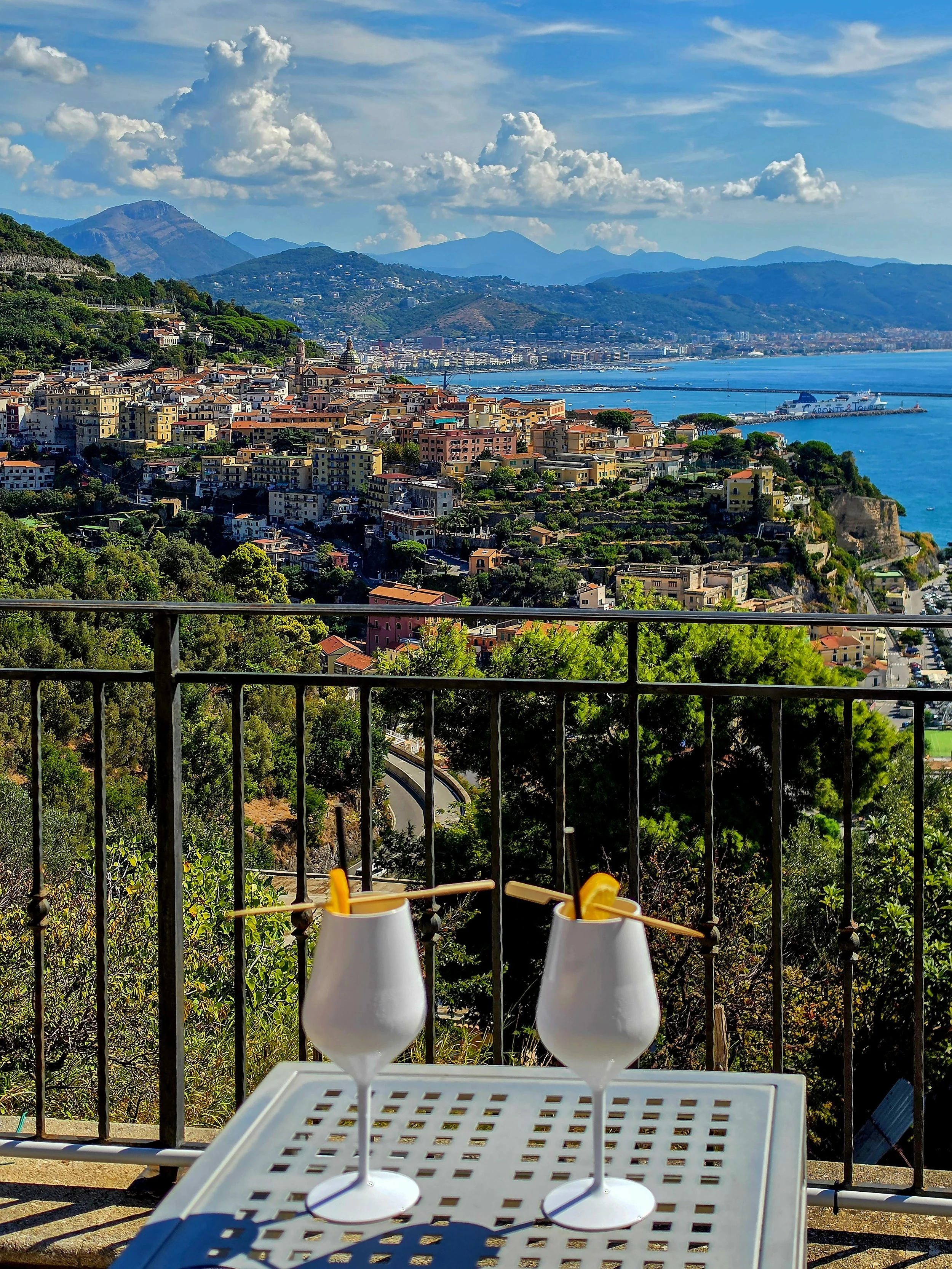 Two cocktails overlooking the colorful town of Vietri sul Mare and the Gulf of Salerno